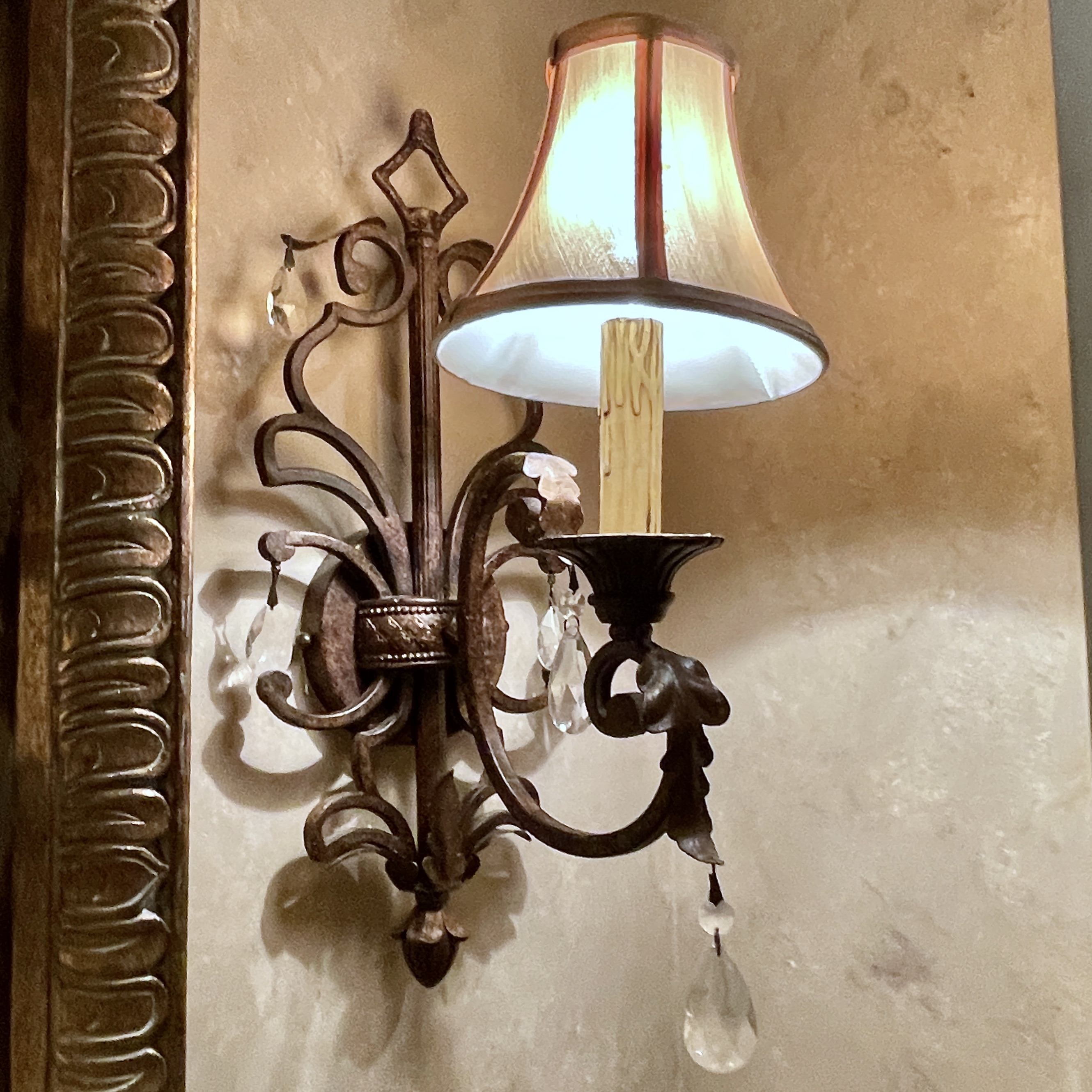 Pair of Antiqued Metal Wall Sconces with Decorative Wall Plates