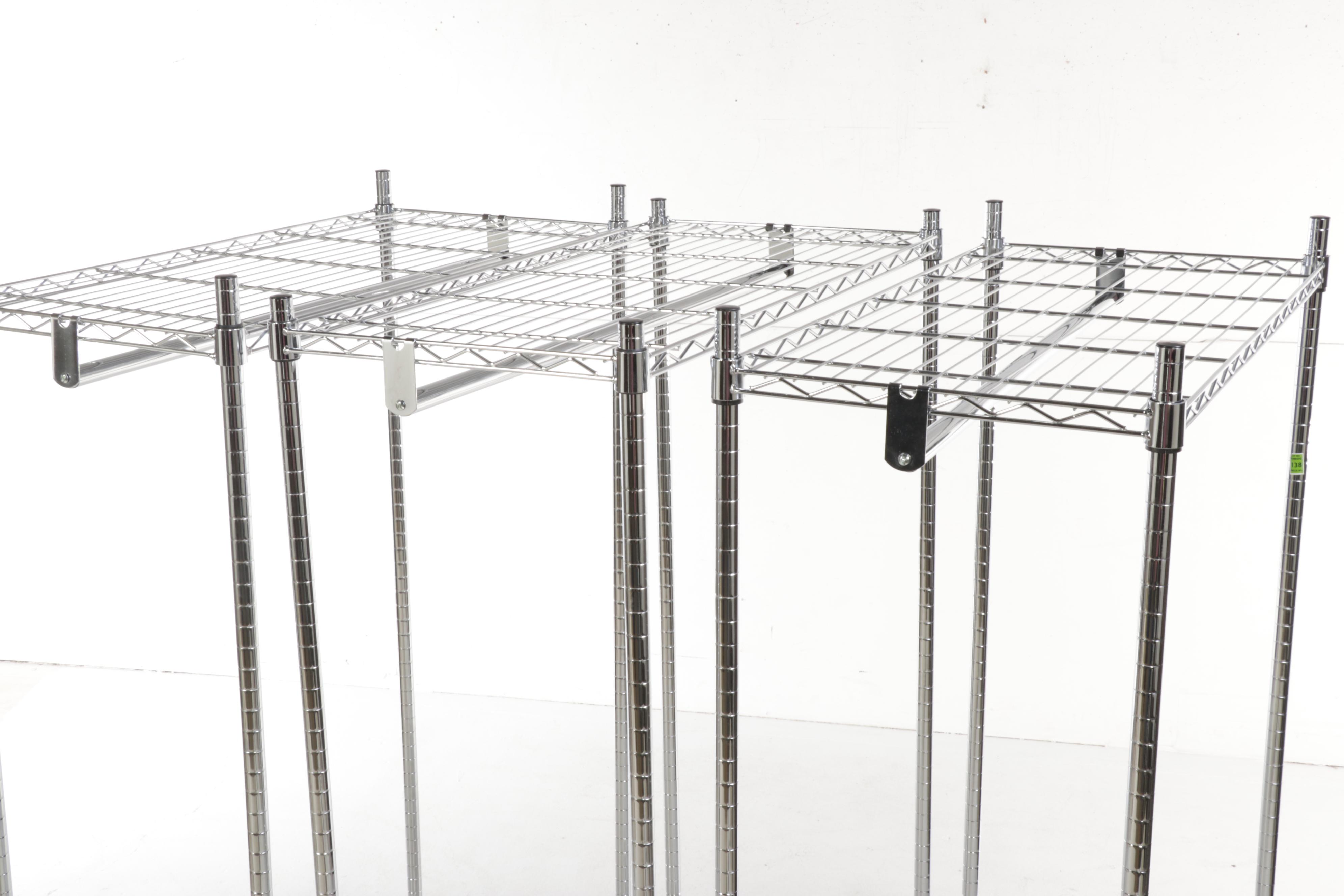 Four Chromed Metal Rolling Garment Racks