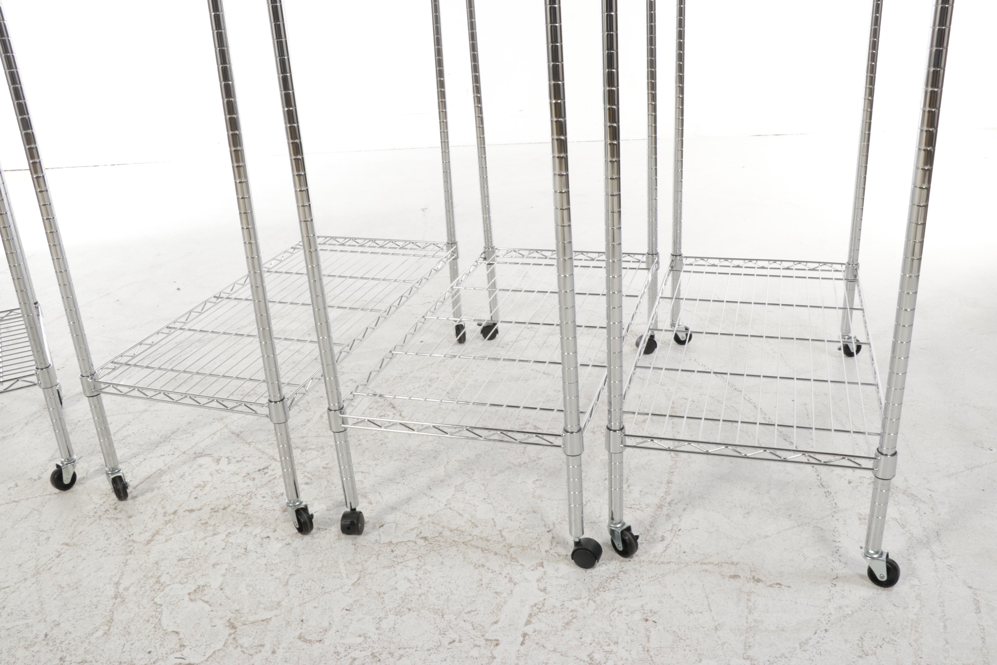 Four Chromed Metal Rolling Garment Racks