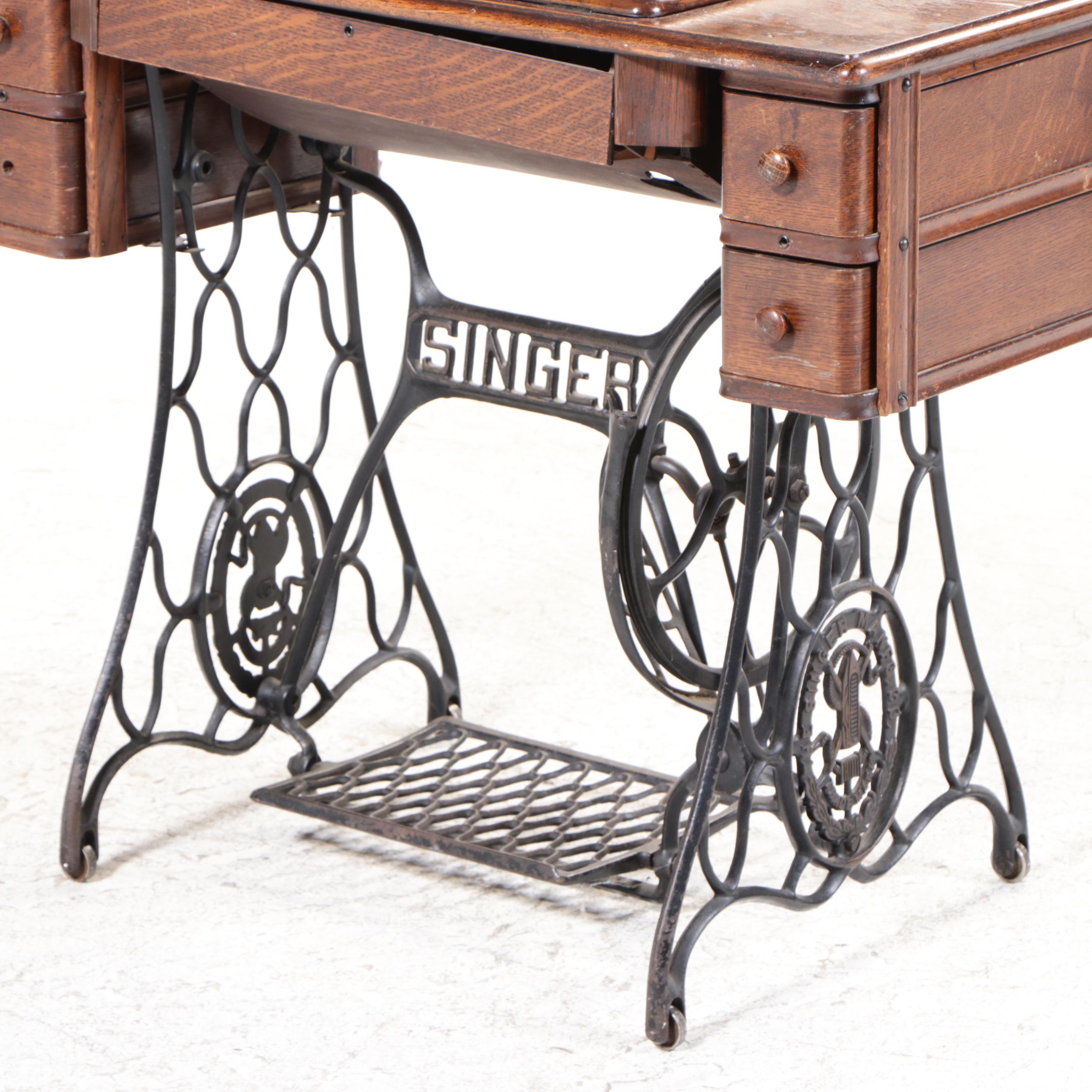Singer Model 66 Red-Eye Sewing Machine, Oak and Cast Iron Treadle Cabinet, 1920s