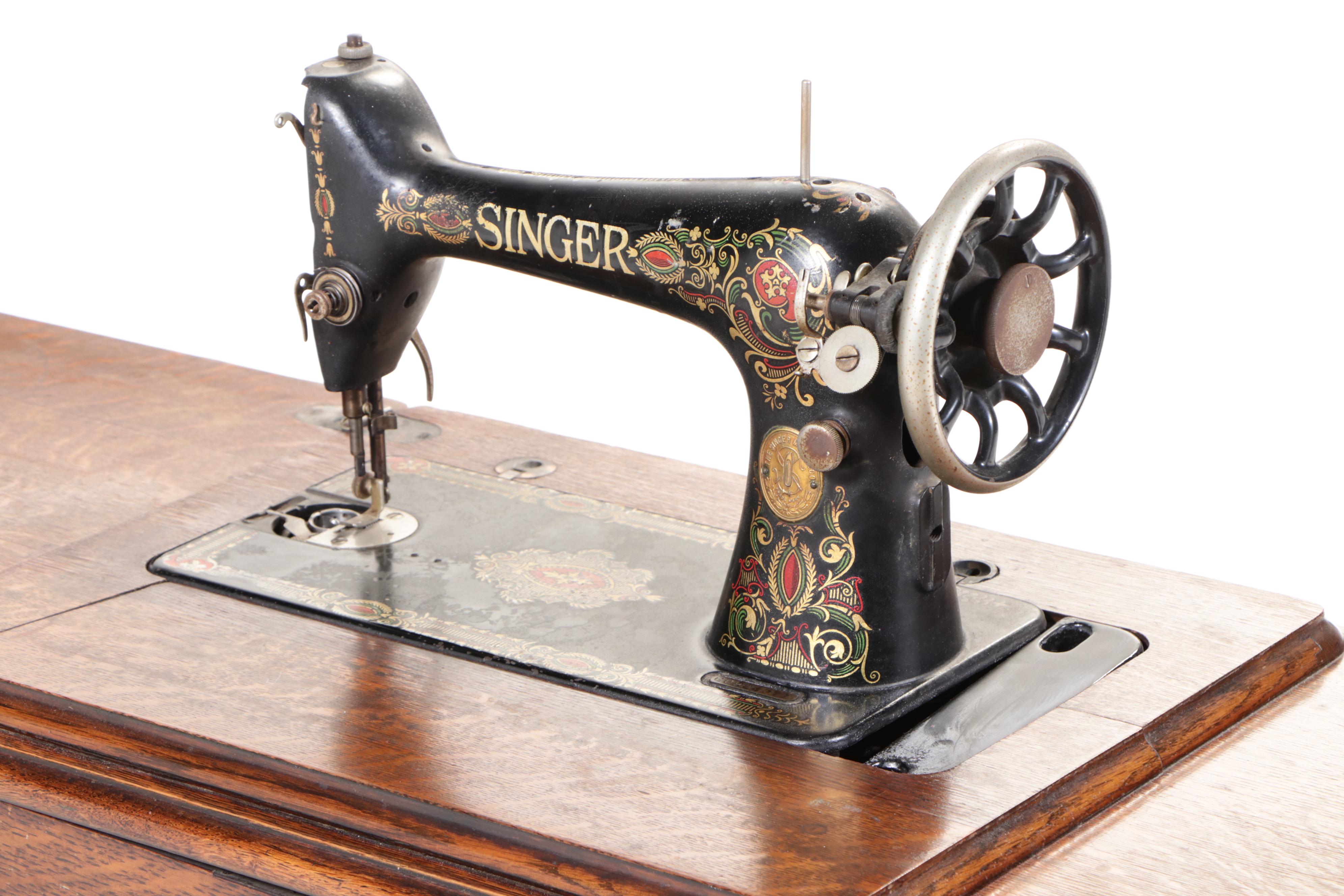 Singer Model 66 Red-Eye Sewing Machine, Oak and Cast Iron Treadle Cabinet, 1920s