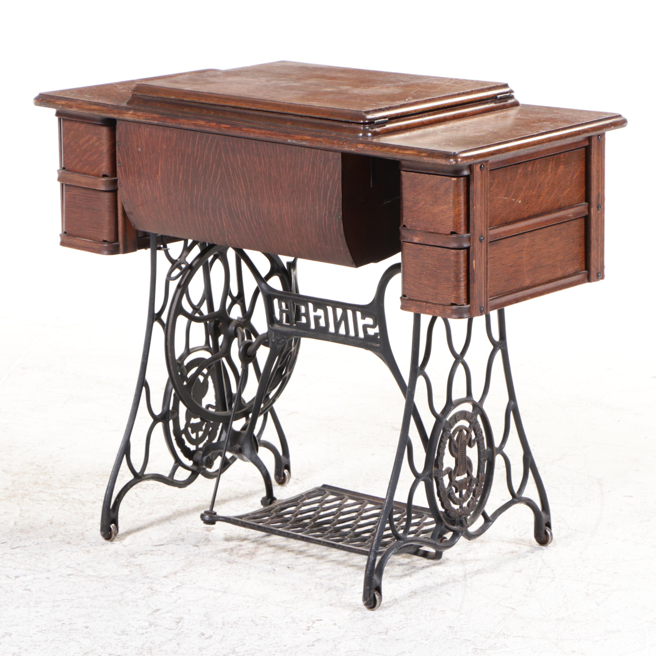 Singer Model 66 Red-Eye Sewing Machine, Oak and Cast Iron Treadle Cabinet, 1920s