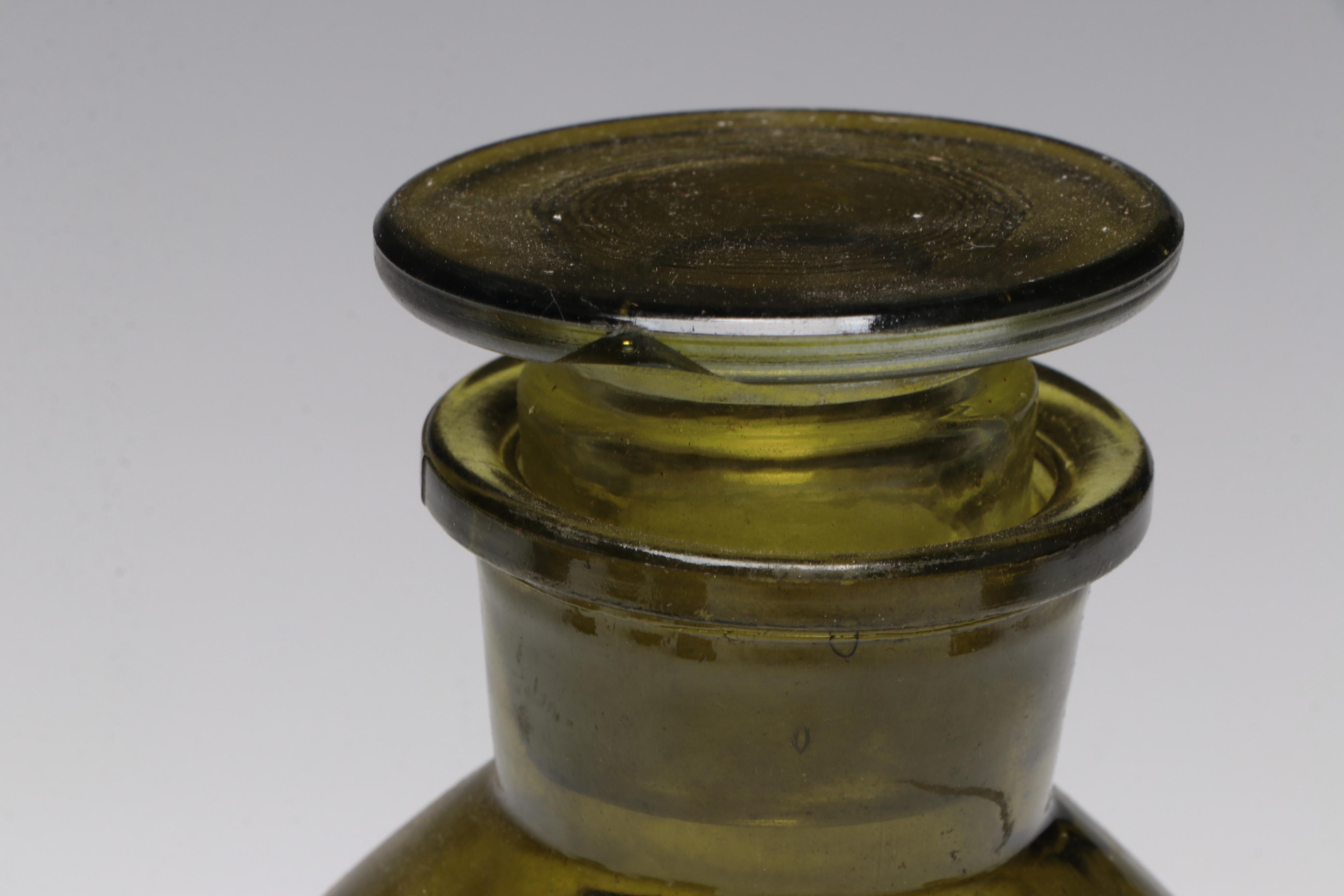 Olive and Clear Glass Apothecary Bottles With Drawer and Glass Bowl