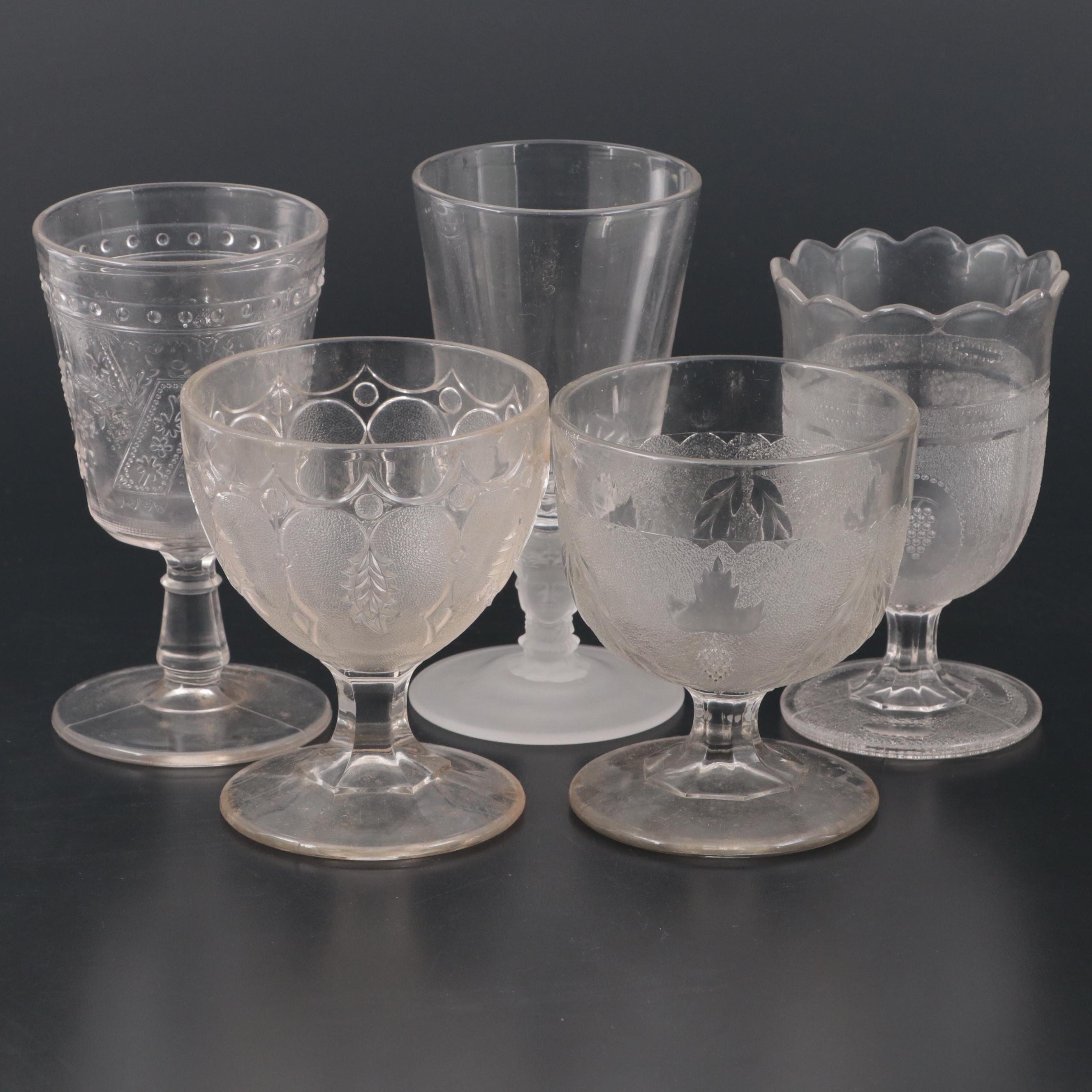 Duncan and Miller "Three Faces" Glass Water Goblet with More Table Accessories