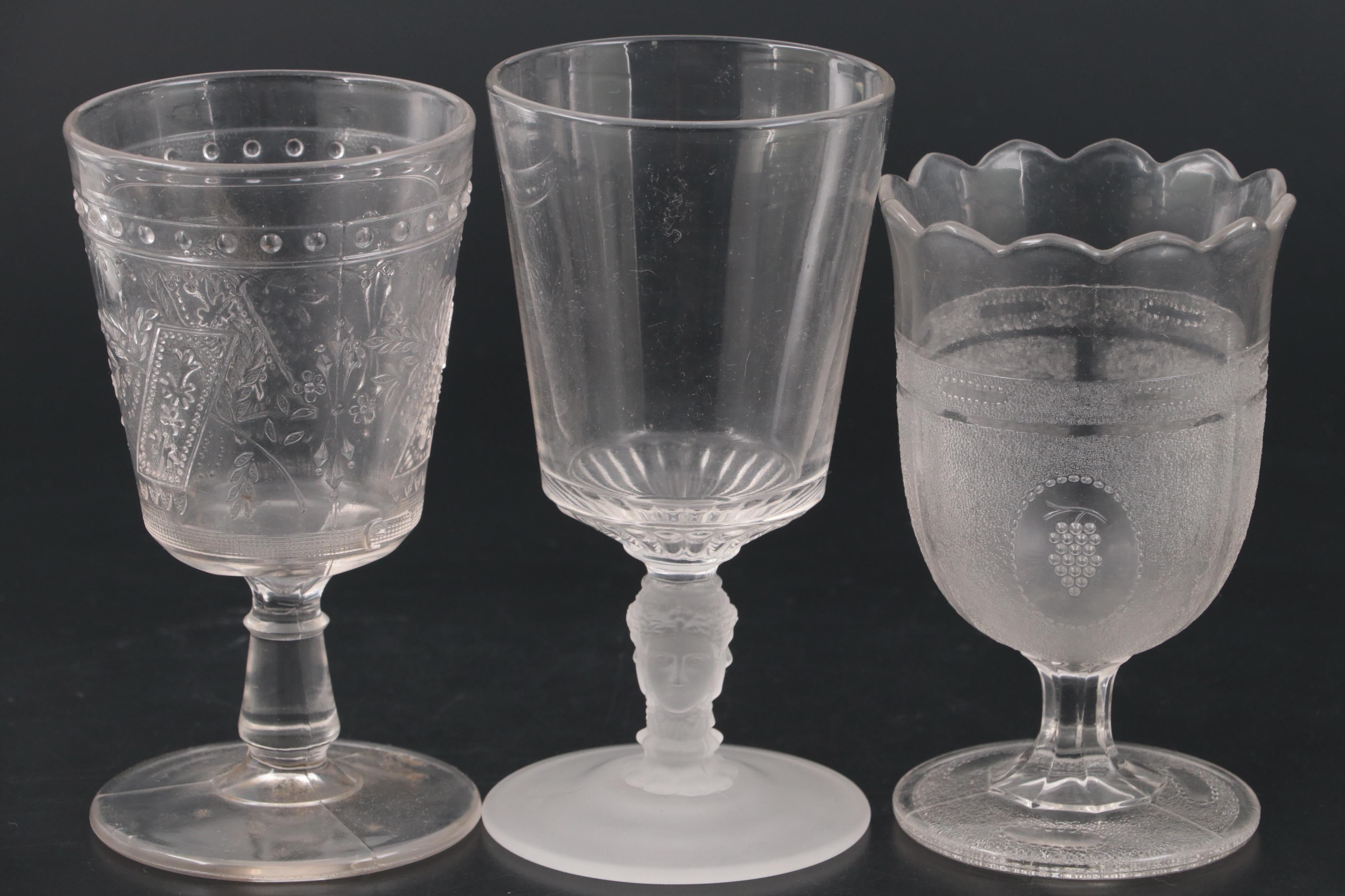 Duncan and Miller "Three Faces" Glass Water Goblet with More Table Accessories