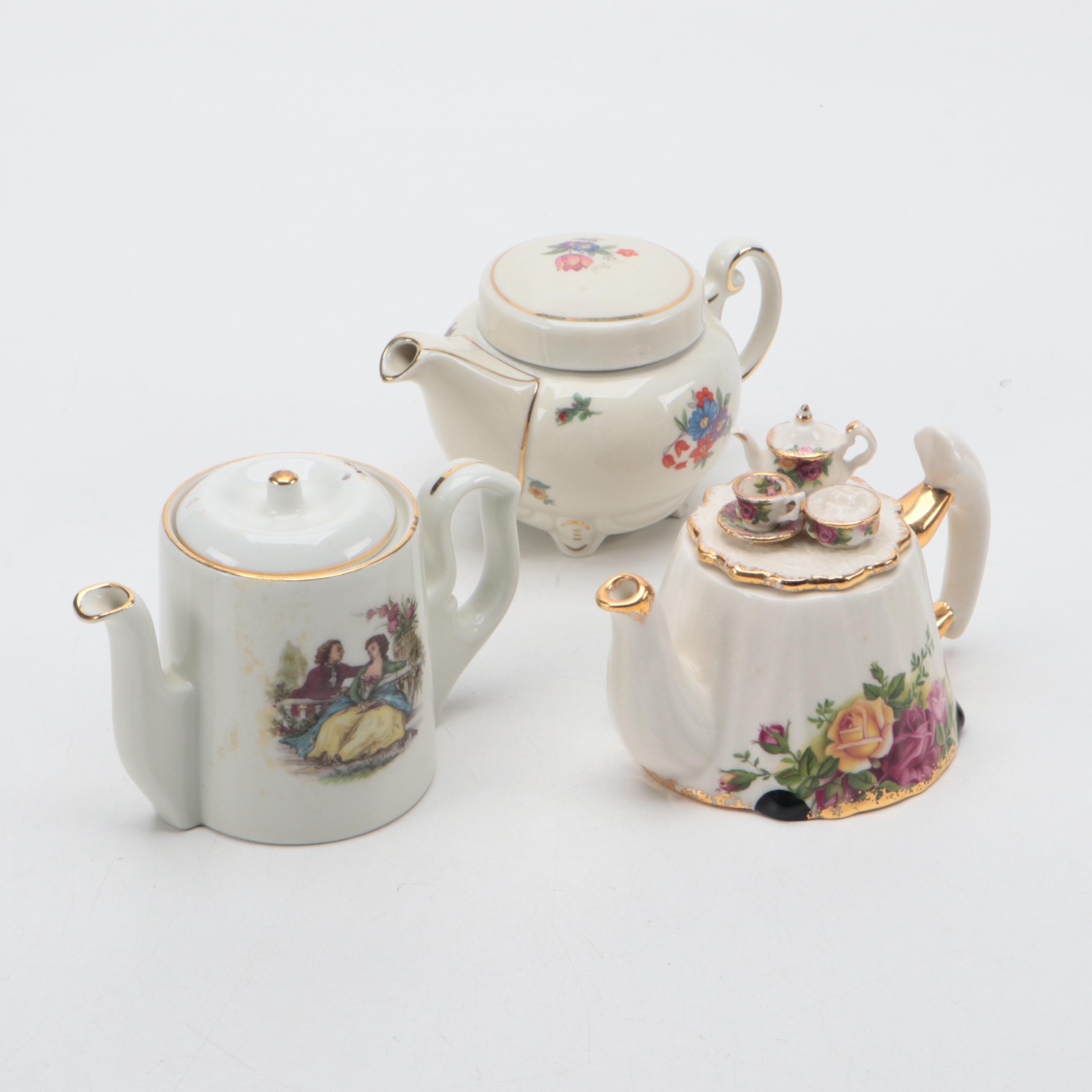Lefton Porcelain Music Box with Harrods Tea Set and Other Teapots