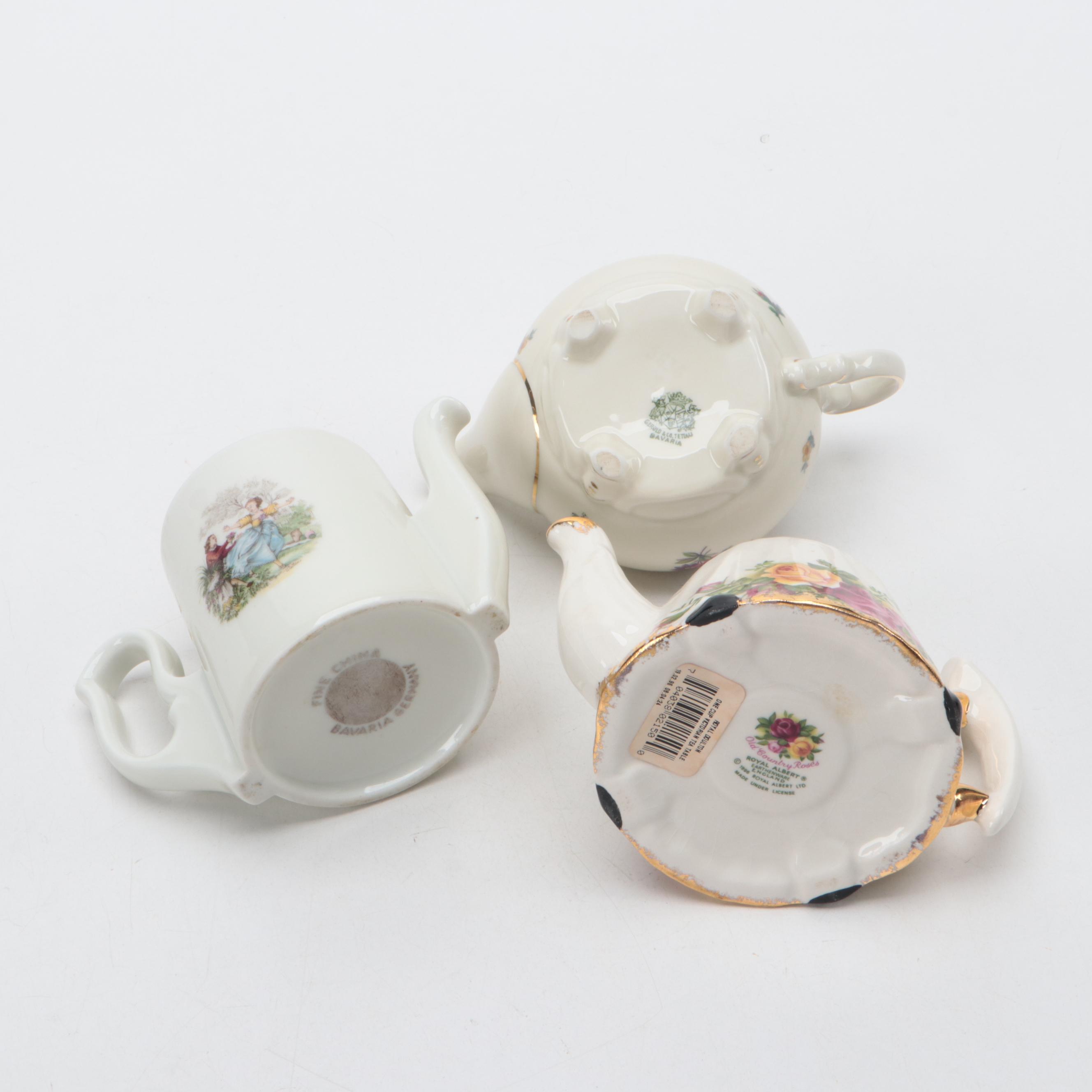 Lefton Porcelain Music Box with Harrods Tea Set and Other Teapots