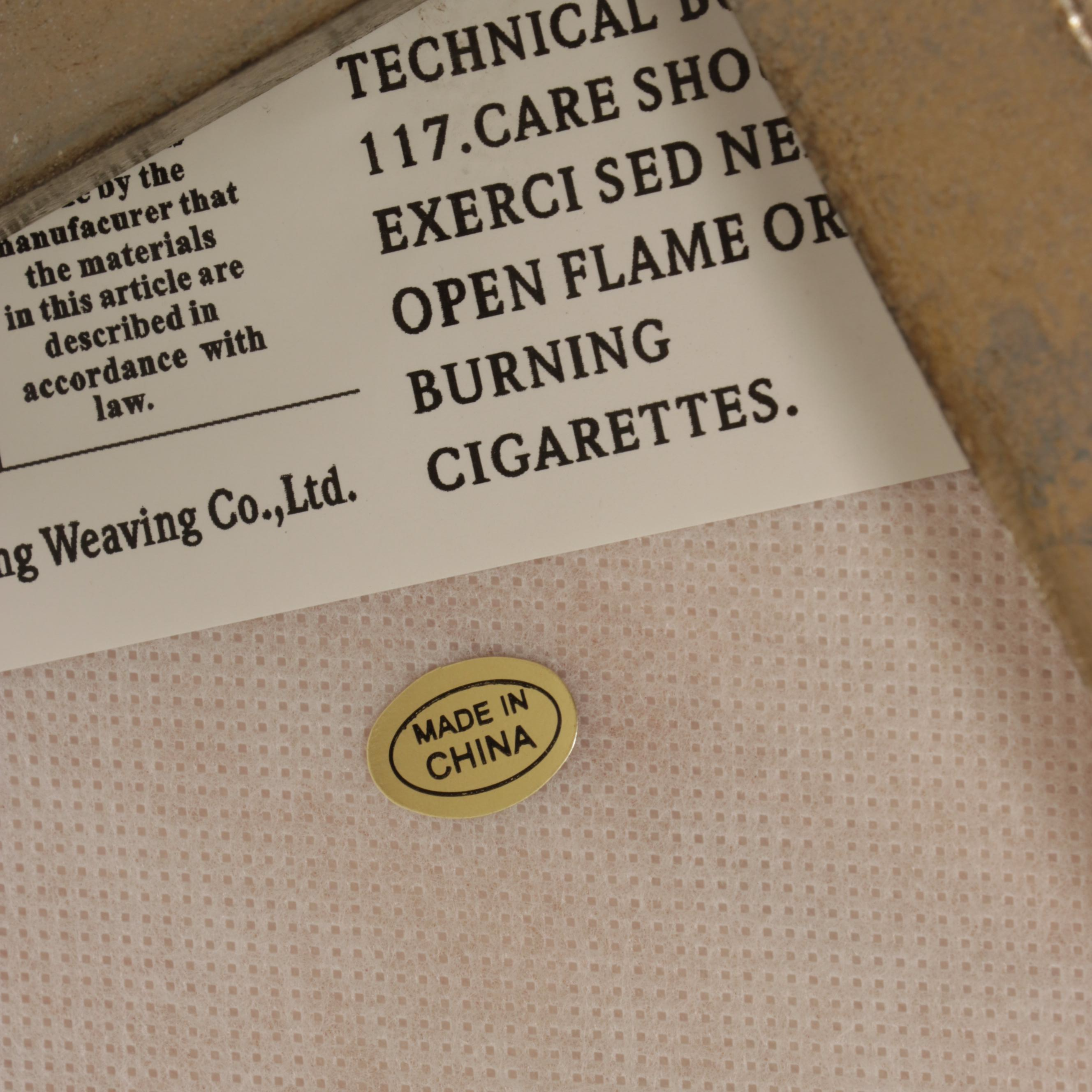 Modernist Style Gilt Metal and Linen Blend Upholstered Cocktail Ottoman