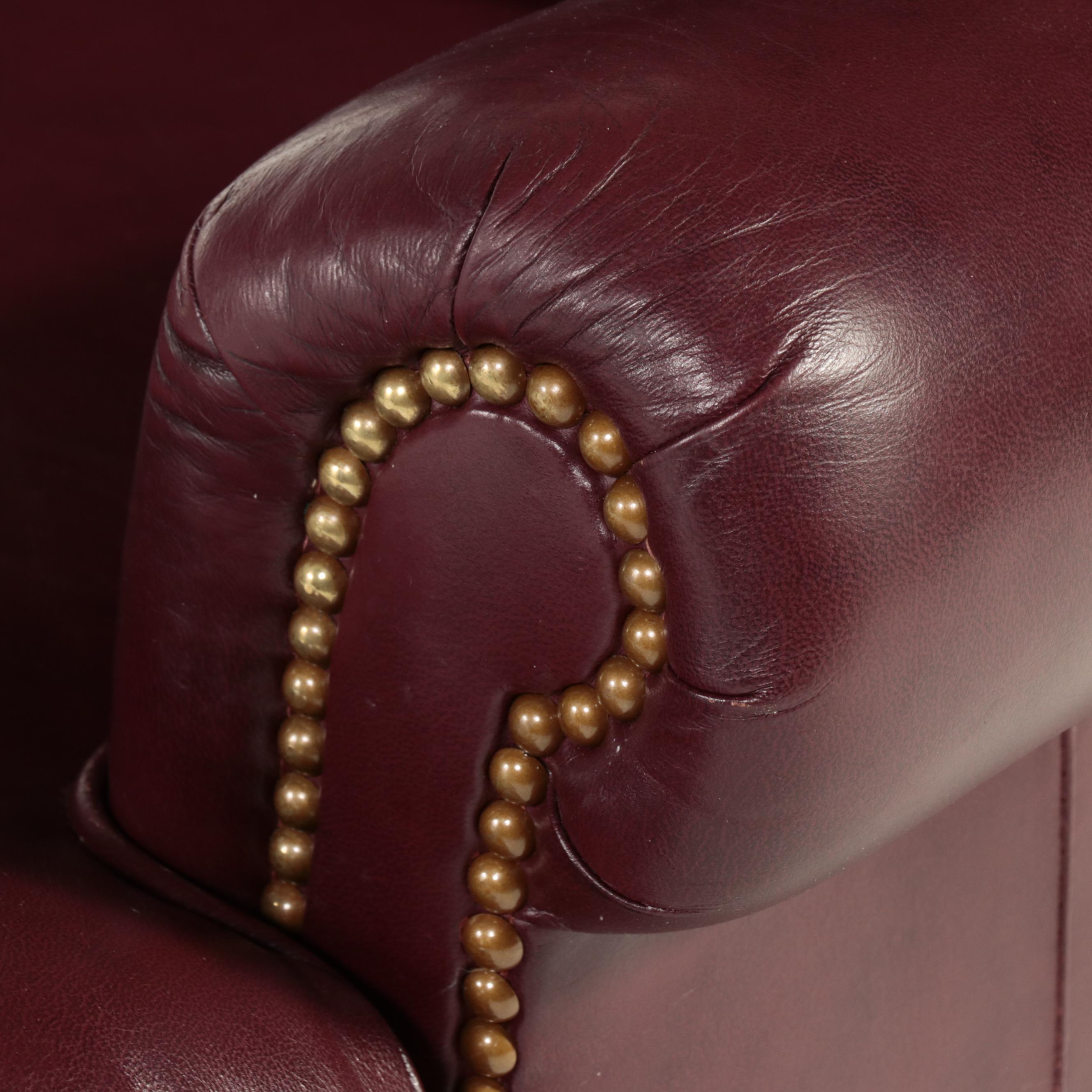 Hancock & Moore Brass-Tacked and Burgundy Leather Reclining Armchair and Ottoman