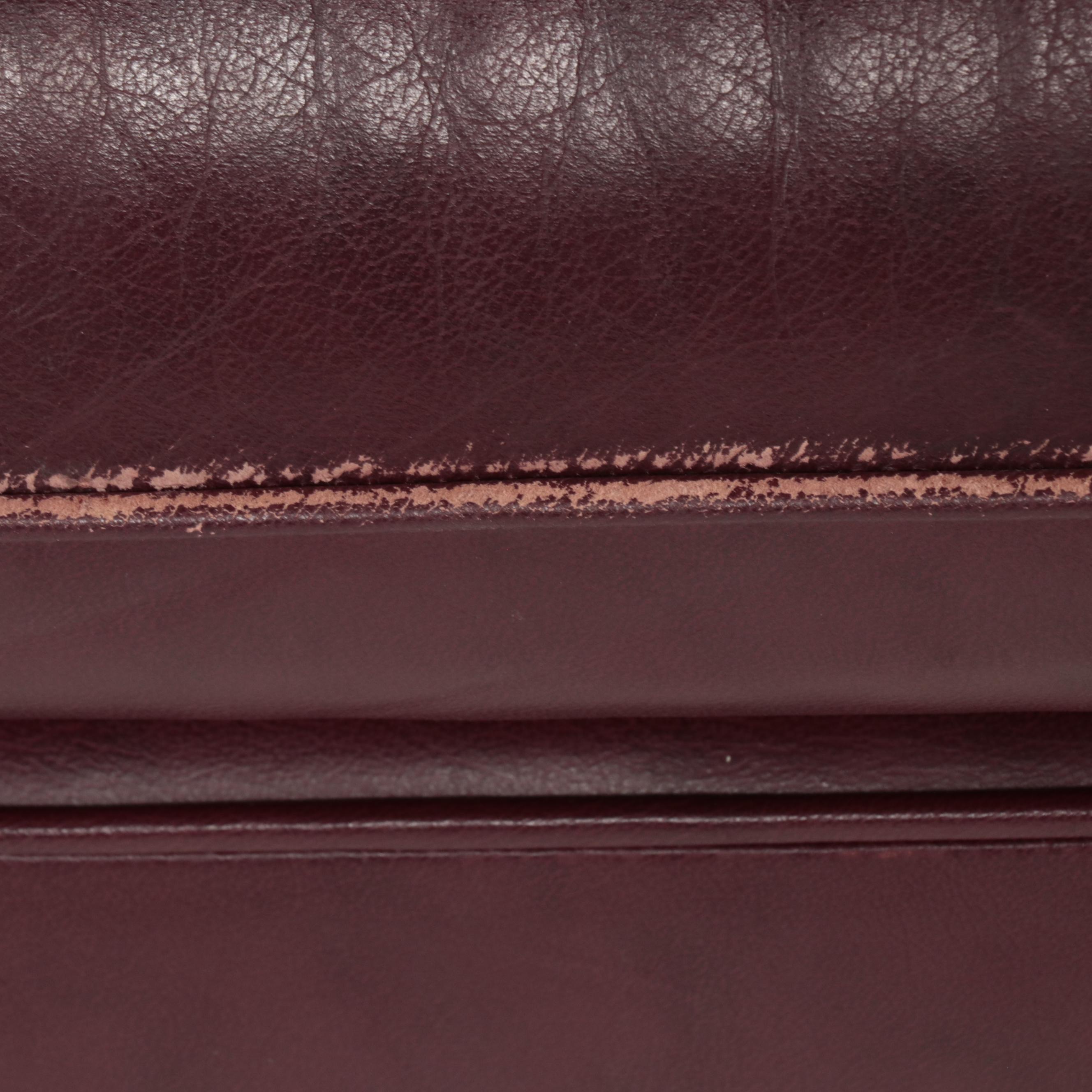 Hancock & Moore Brass-Tacked and Burgundy Leather Reclining Armchair and Ottoman