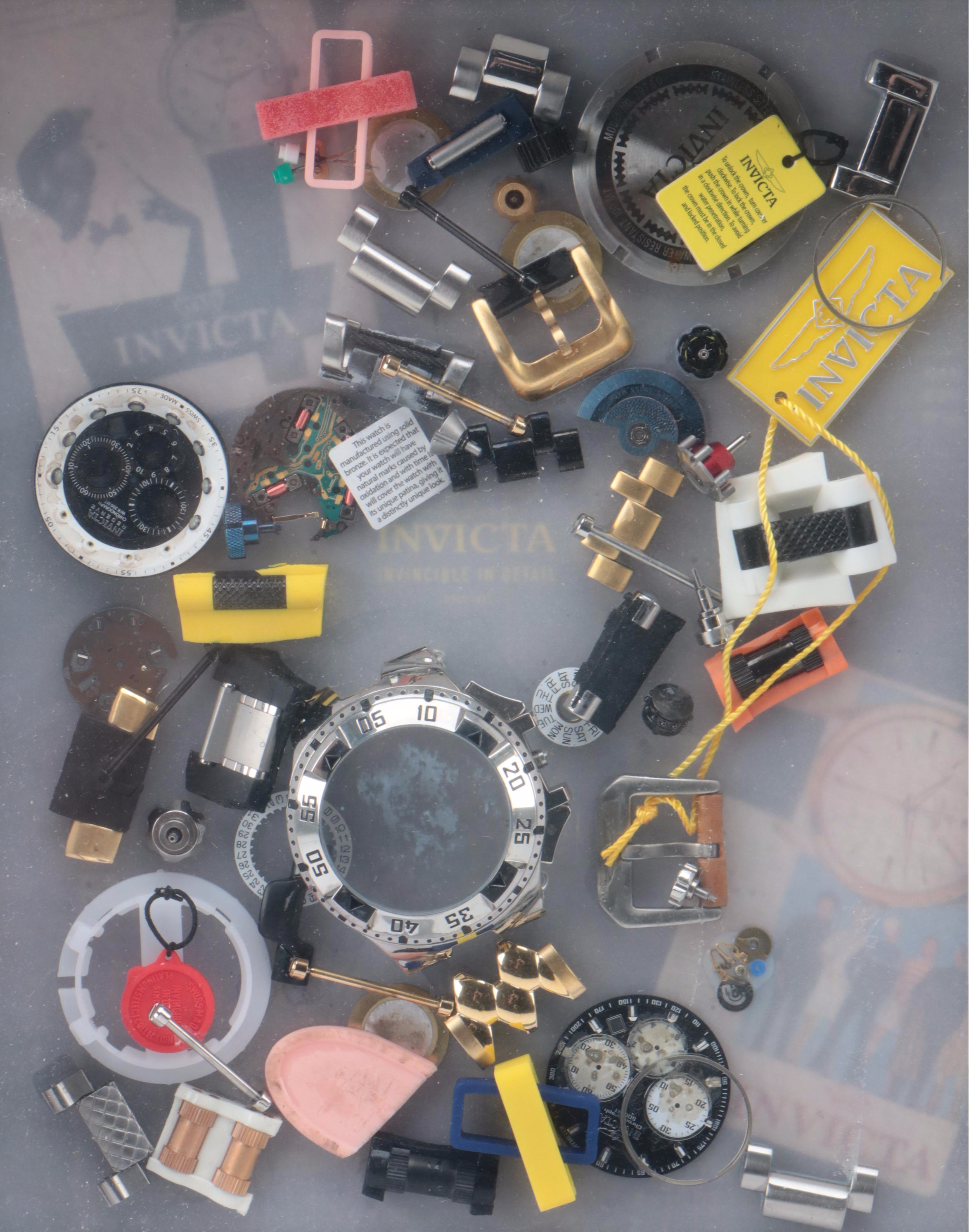 Invicta Watch Pieces in Plastic Shadow Box