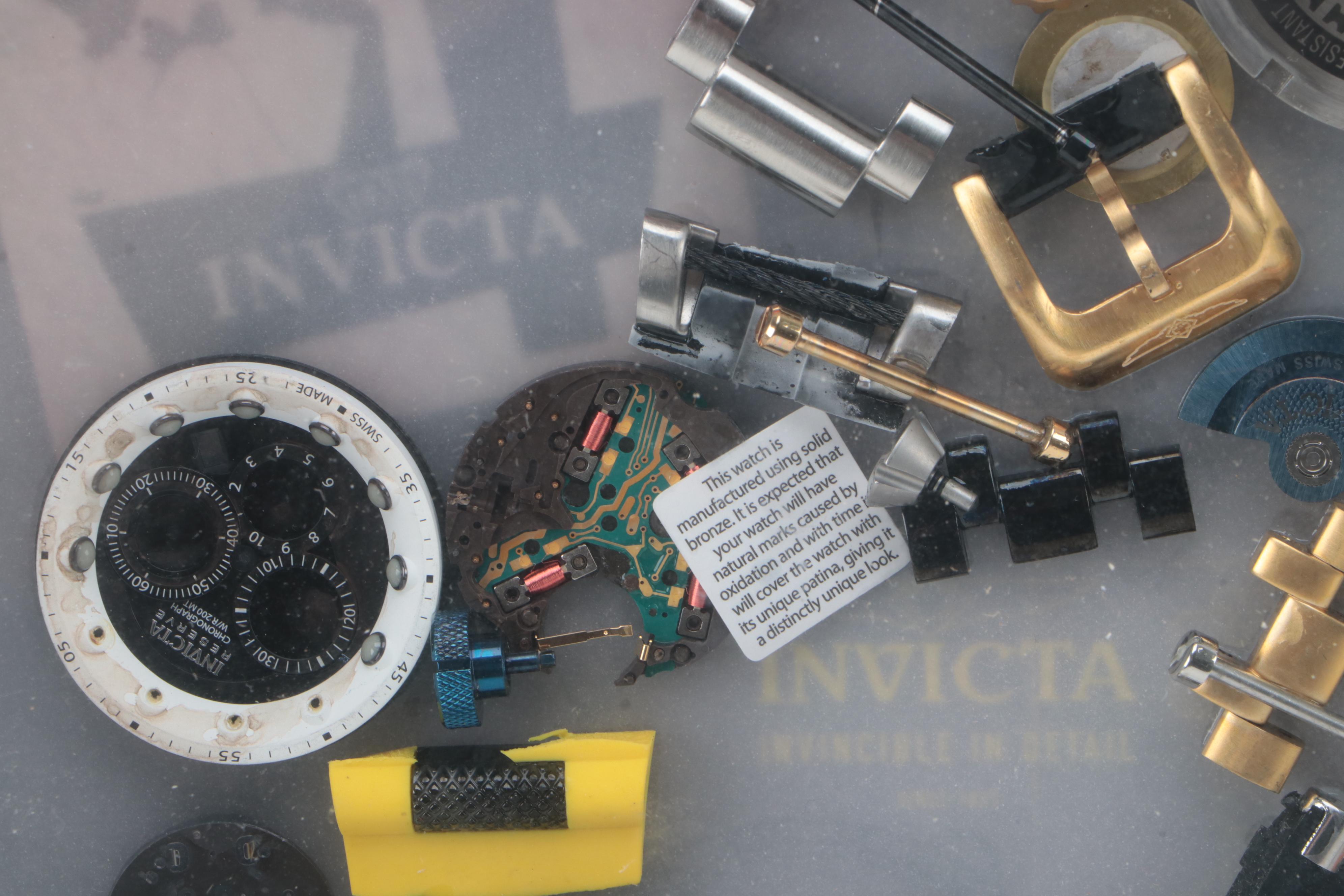 Invicta Watch Pieces in Plastic Shadow Box