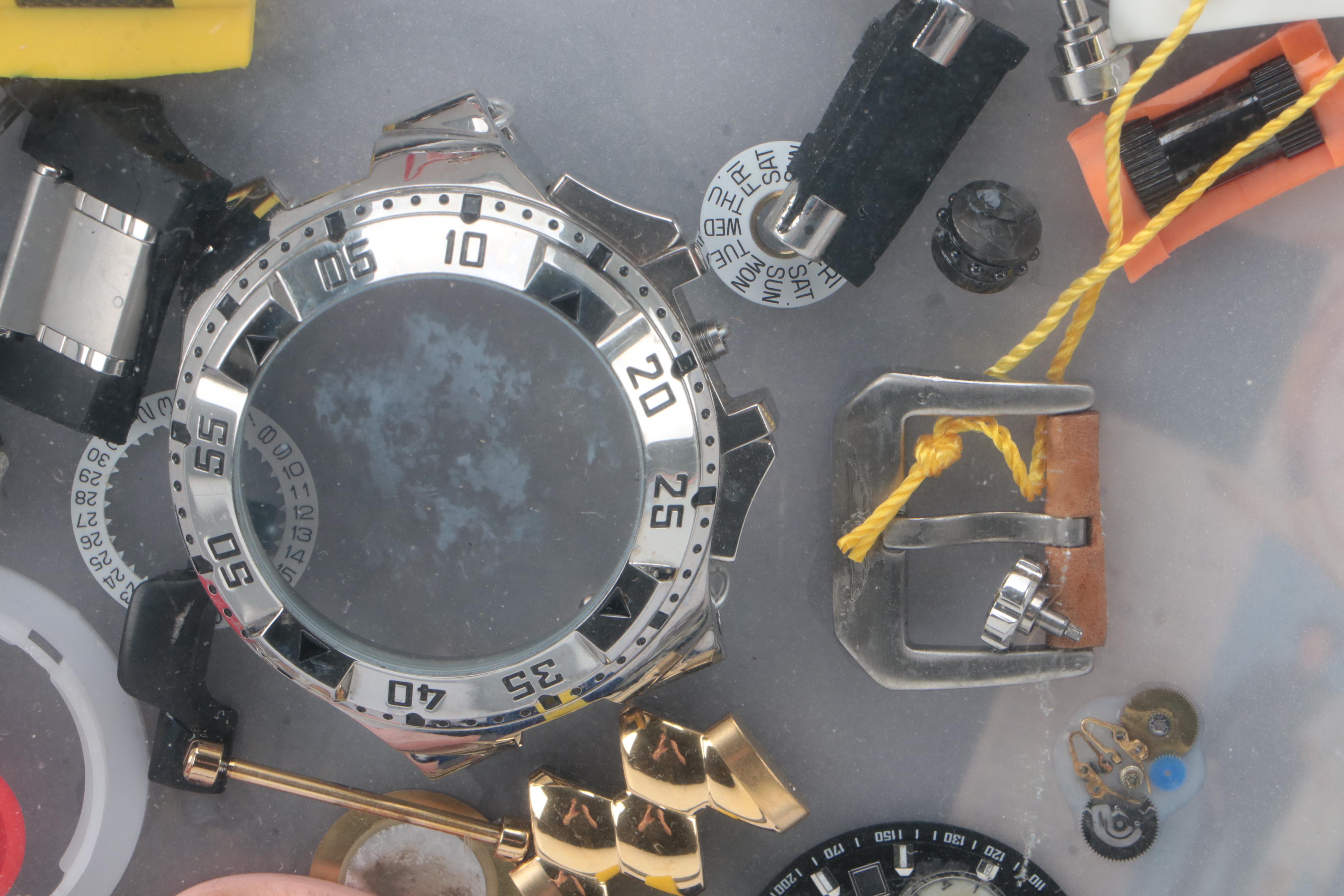 Invicta Watch Pieces in Plastic Shadow Box