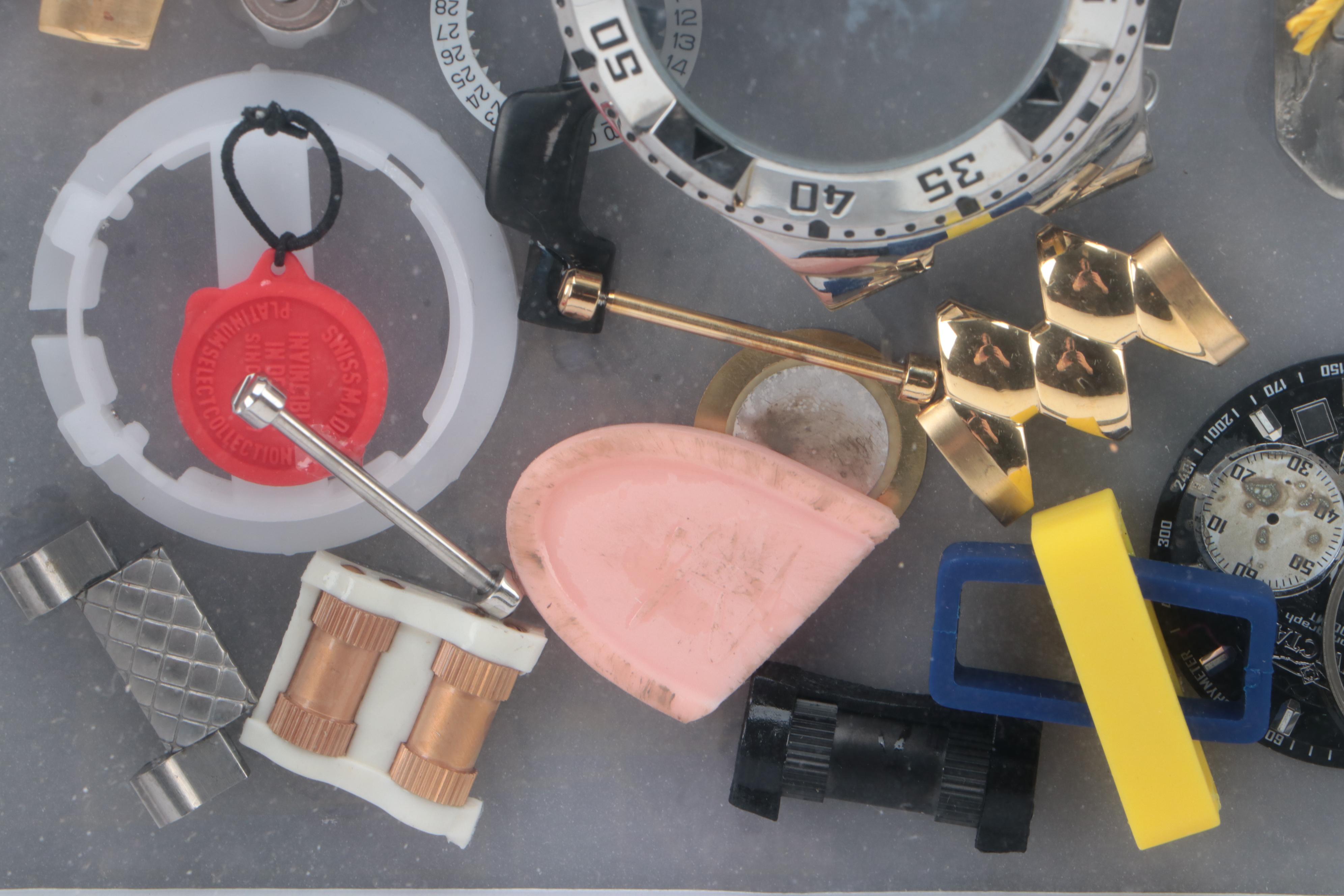 Invicta Watch Pieces in Plastic Shadow Box