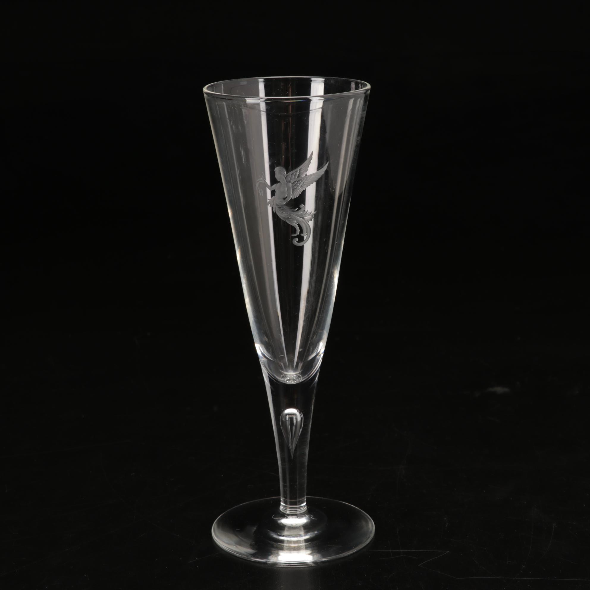 Steuben Flutes with Etched Winged Figure Design and Suspended Bubble Stem