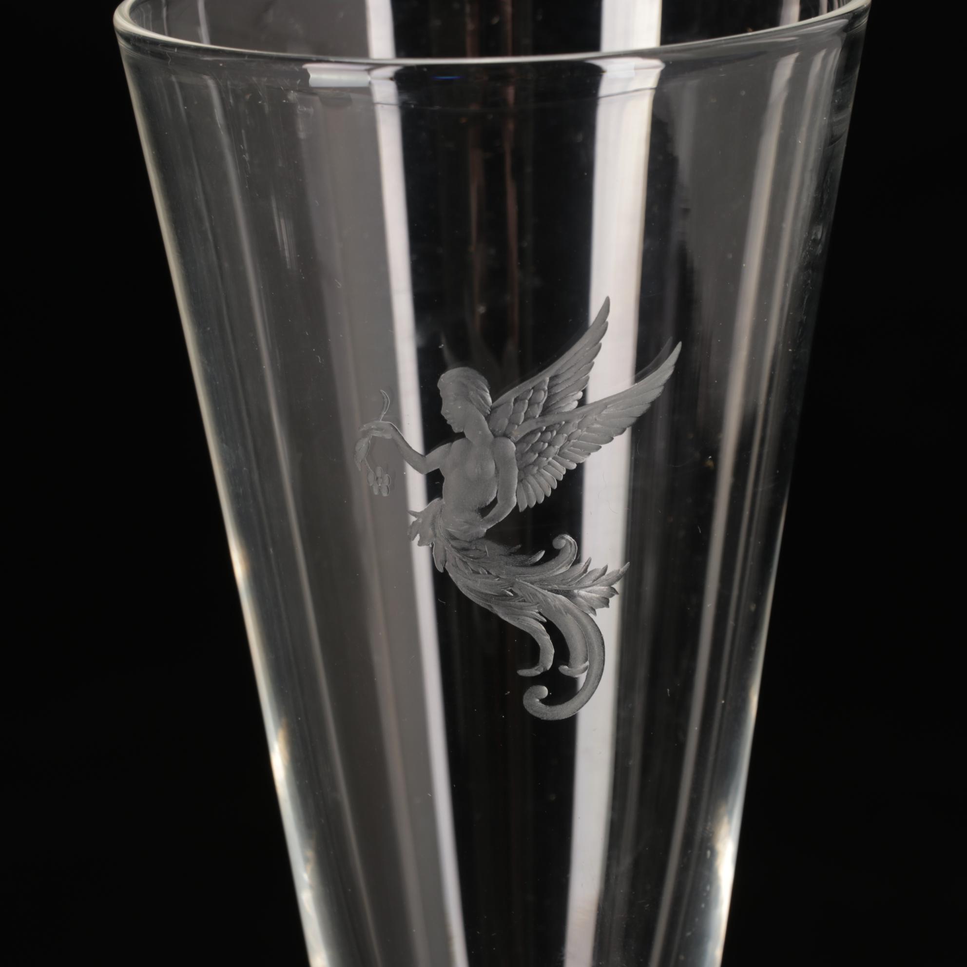 Steuben Flutes with Etched Winged Figure Design and Suspended Bubble Stem