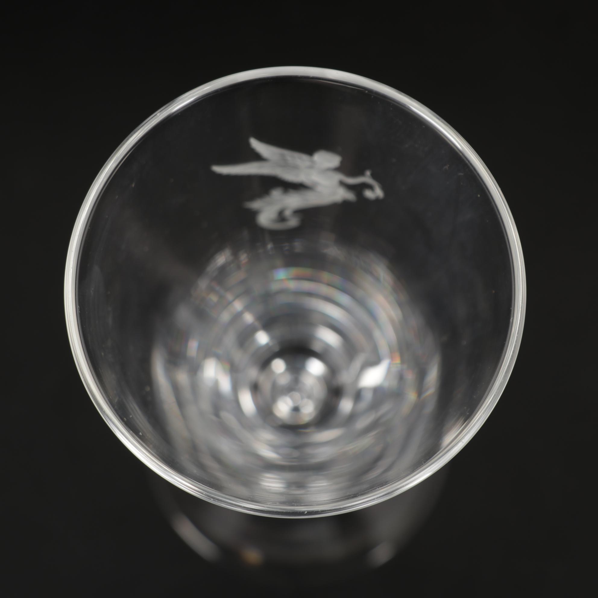 Steuben Flutes with Etched Winged Figure Design and Suspended Bubble Stem
