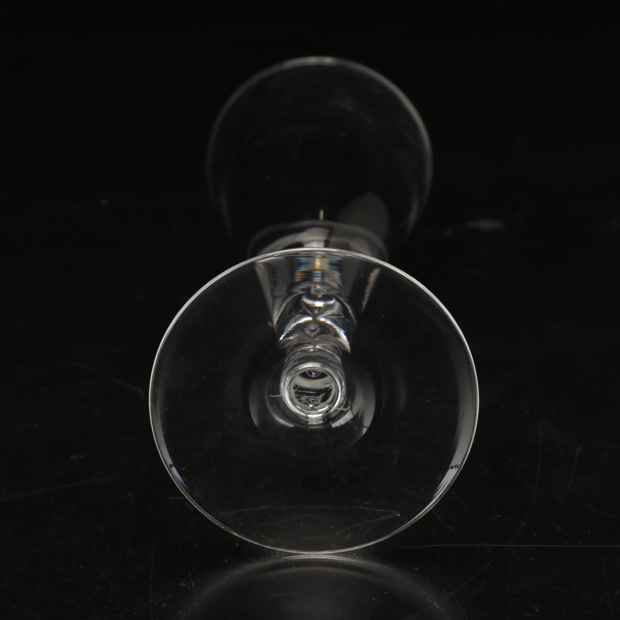 Steuben Flutes with Etched Winged Figure Design and Suspended Bubble Stem