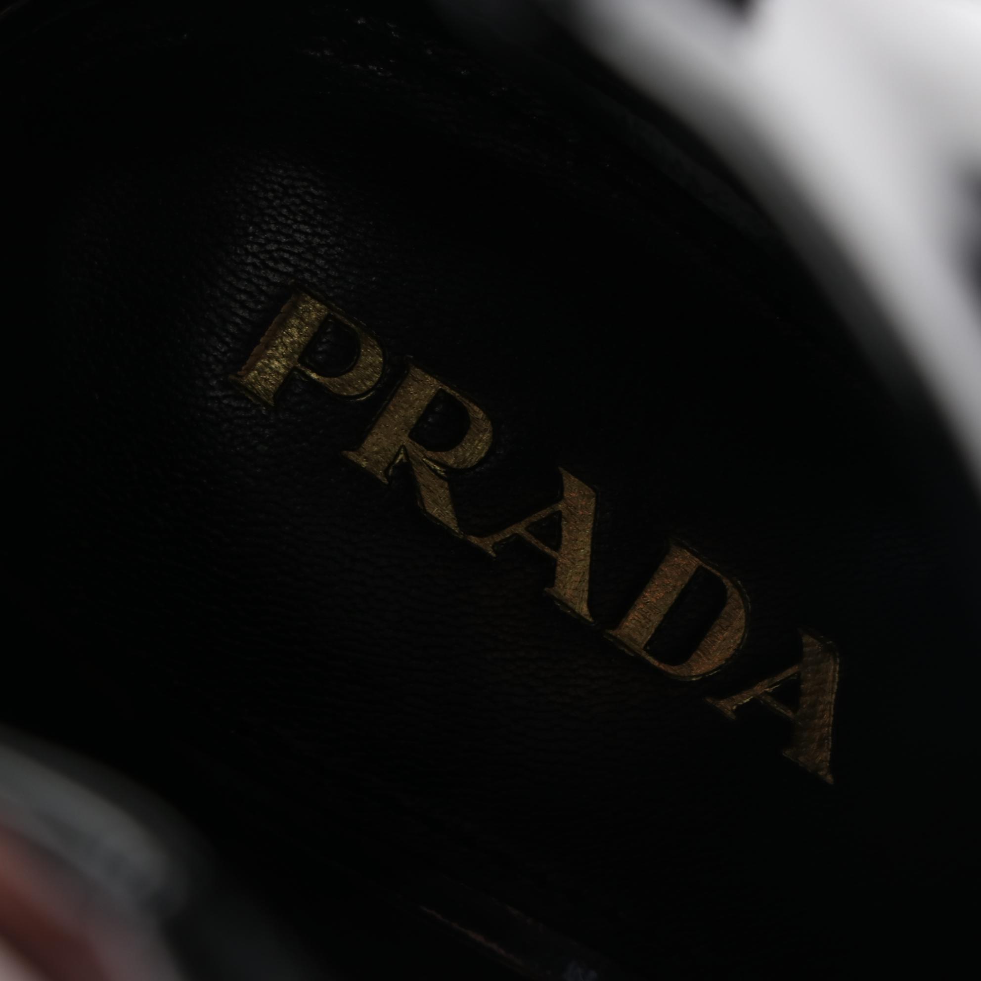 Prada Patent Leather Booties with Geometric Reflective Heel