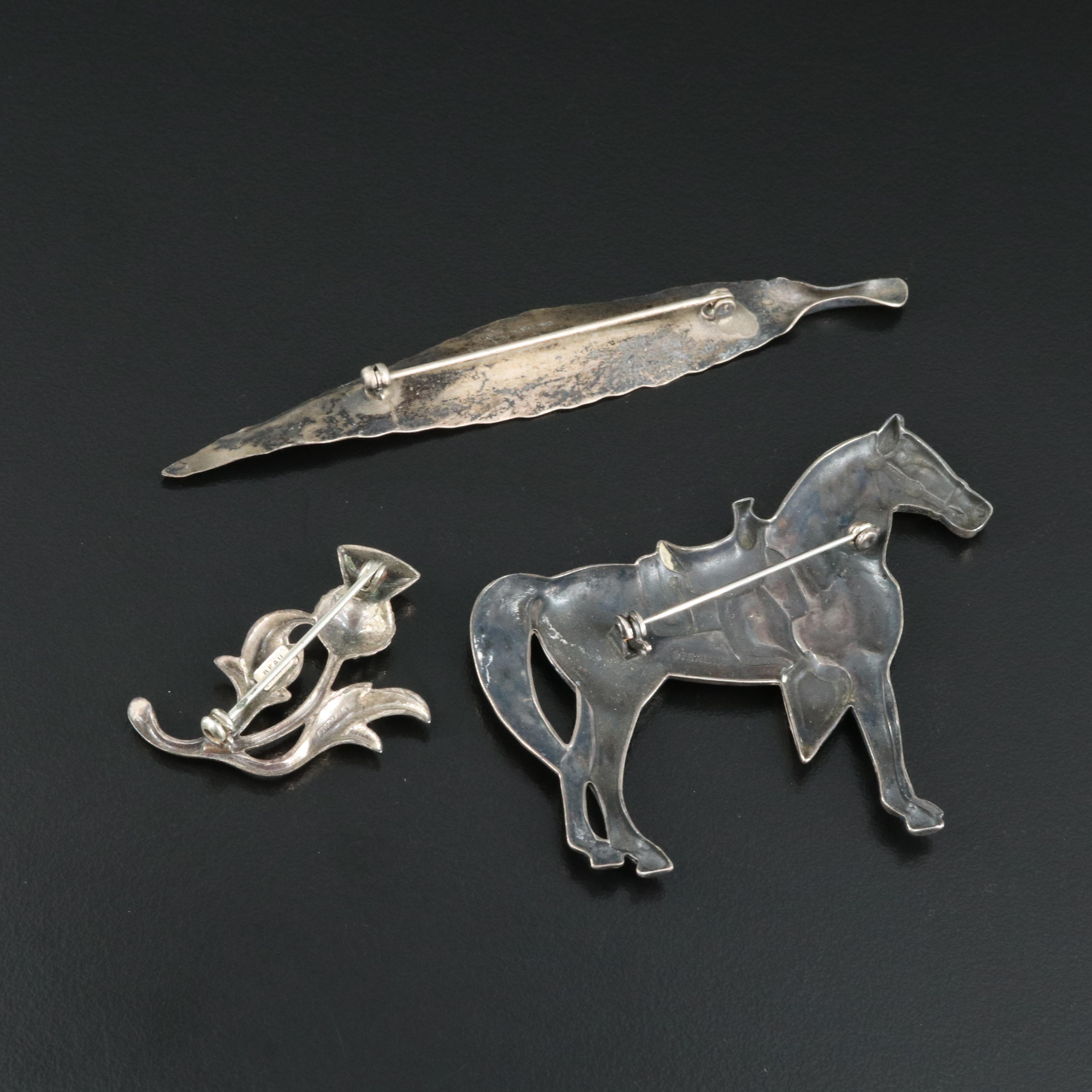 Stuart Nye Leaf and Beau Thistle Featured in Sterling Brooches