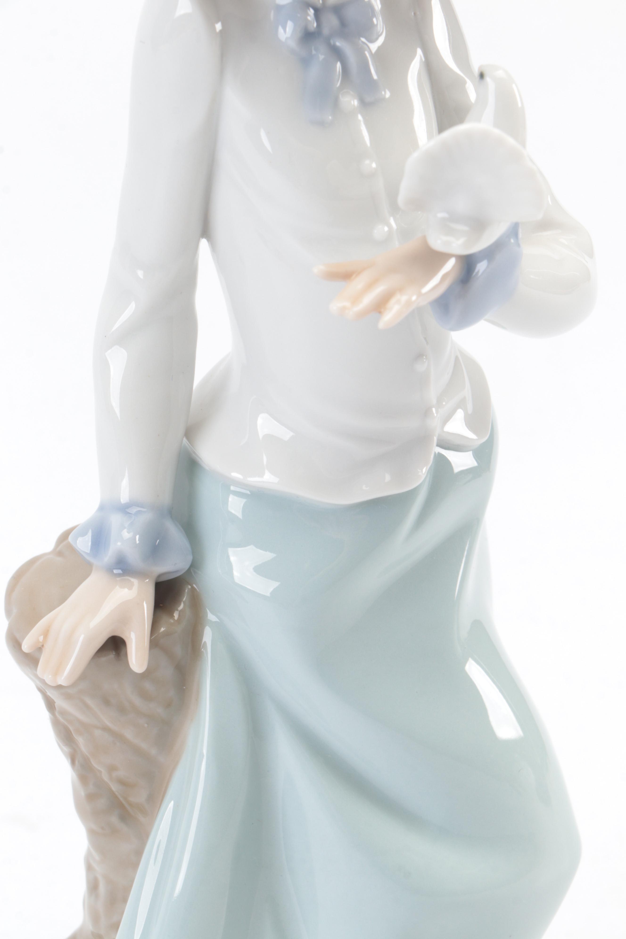 Lladró "Pierrot with Concertina" and Nao by Lladró "Girl with Dove" Figurines