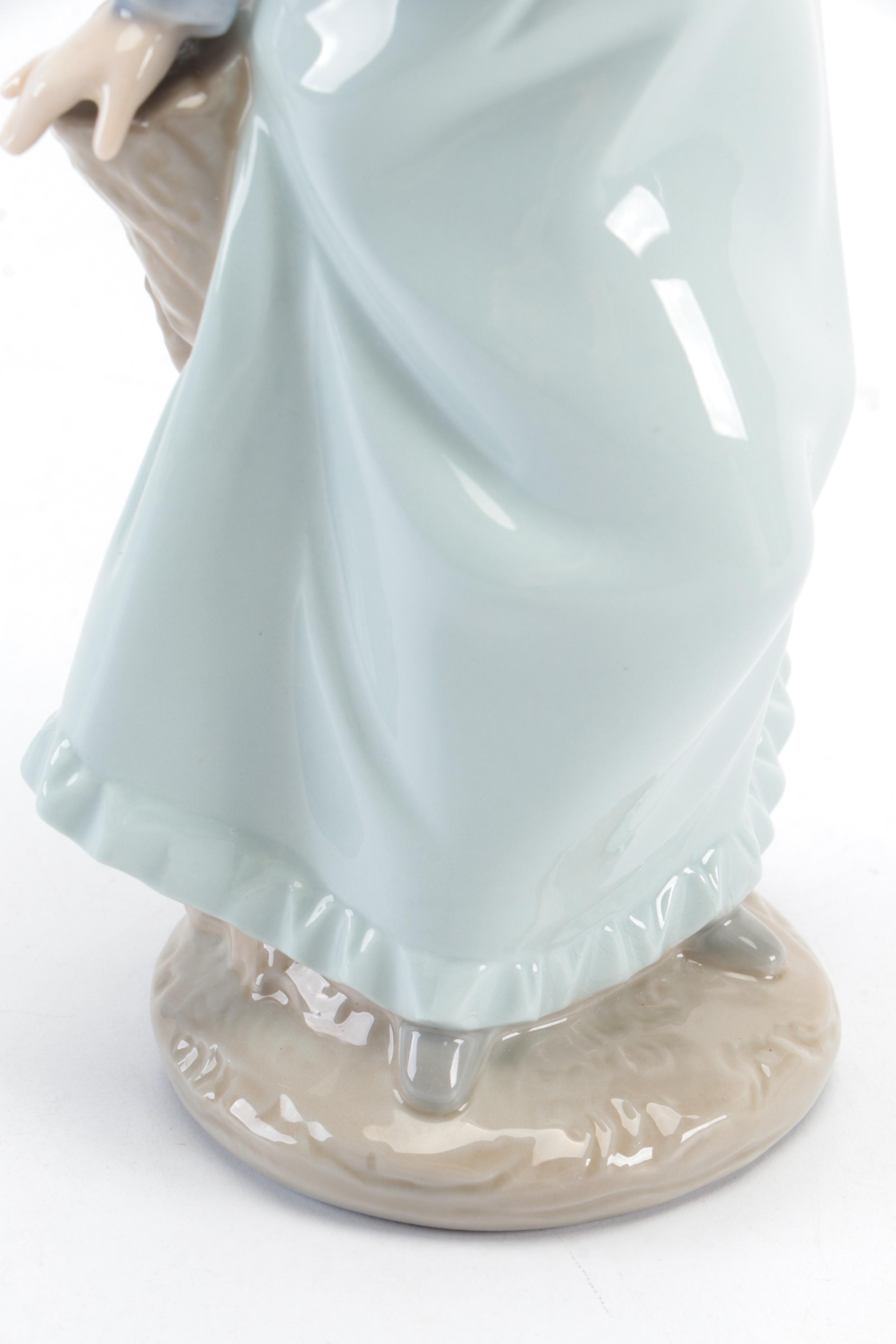 Lladró "Pierrot with Concertina" and Nao by Lladró "Girl with Dove" Figurines