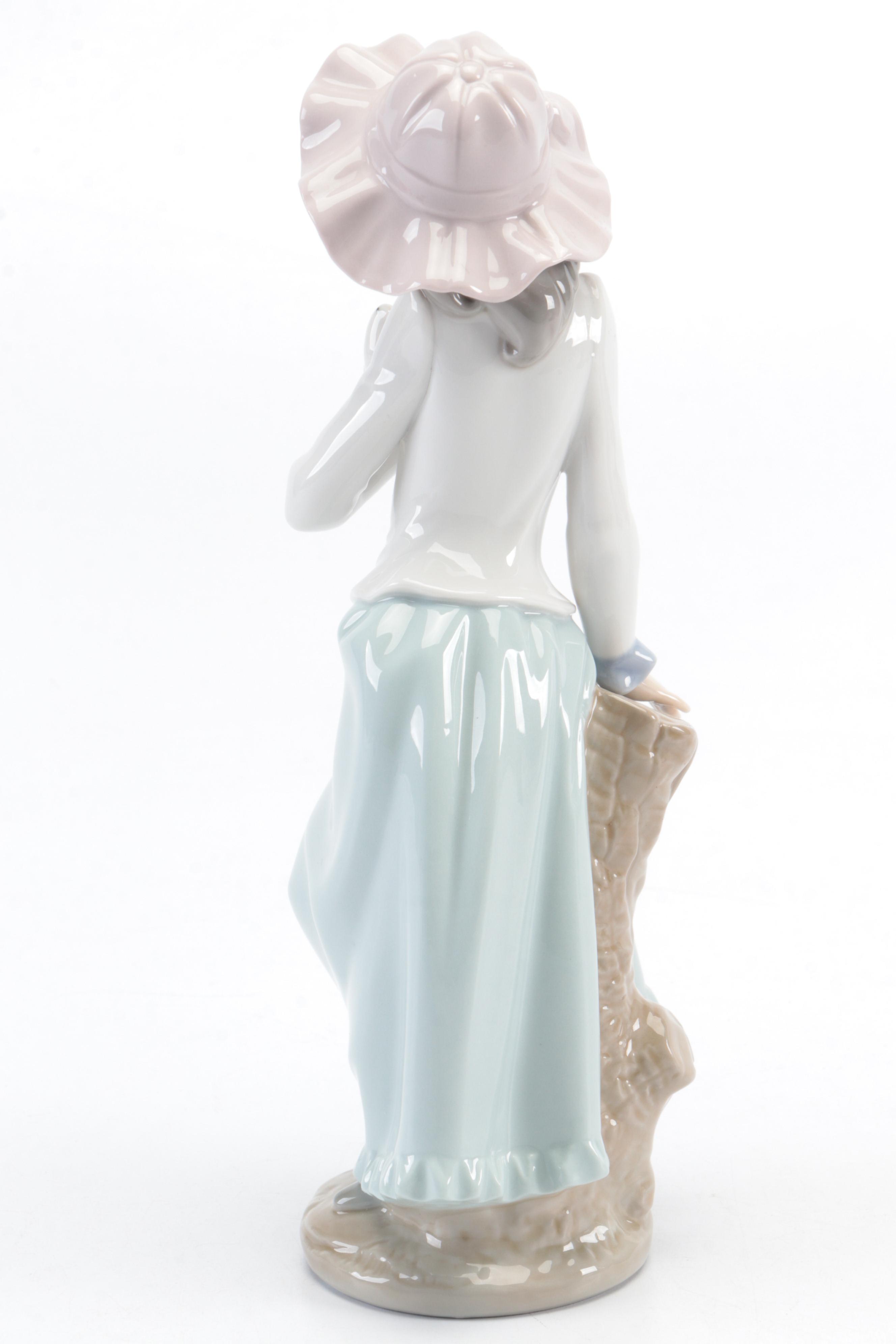 Lladró "Pierrot with Concertina" and Nao by Lladró "Girl with Dove" Figurines