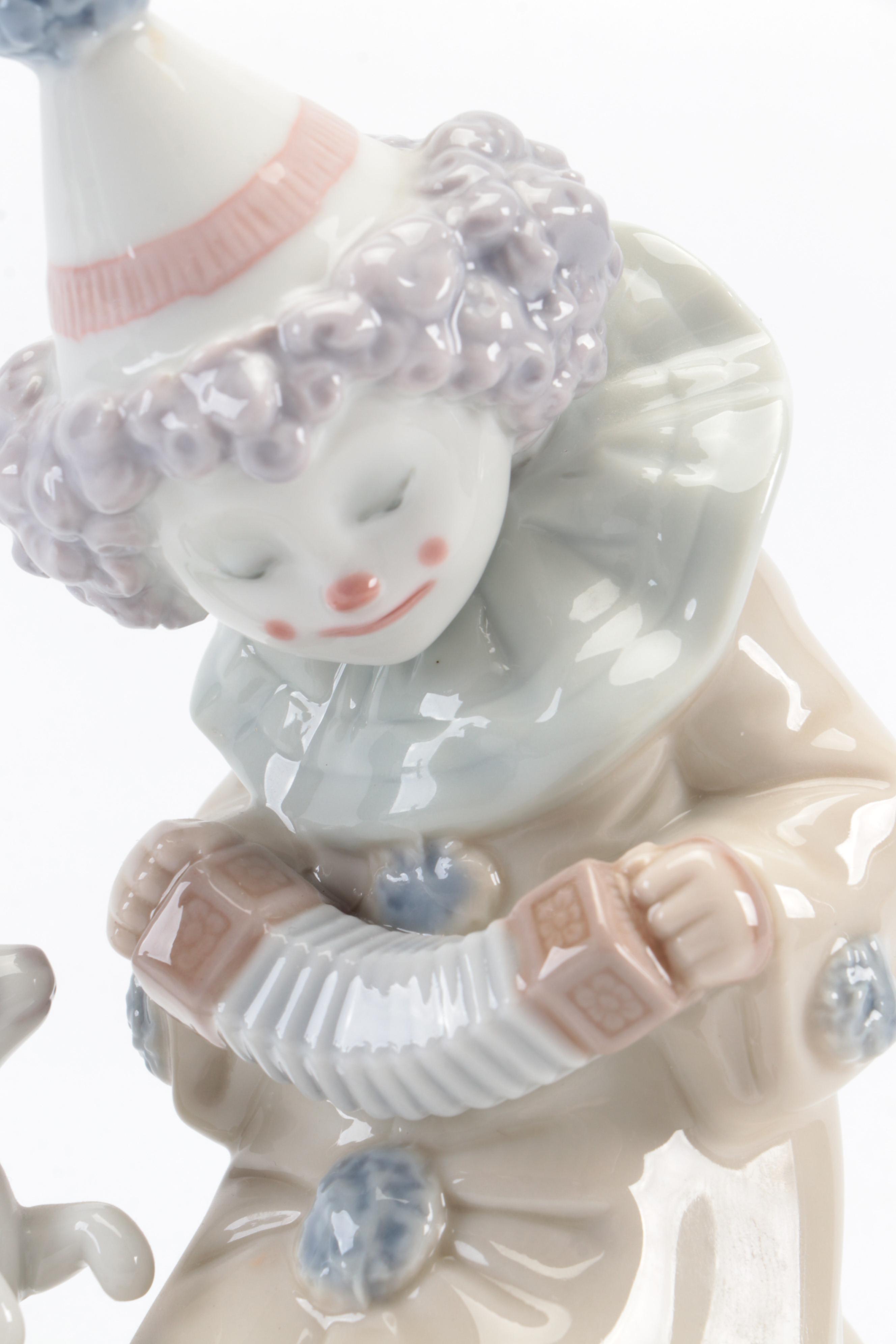 Lladró "Pierrot with Concertina" and Nao by Lladró "Girl with Dove" Figurines