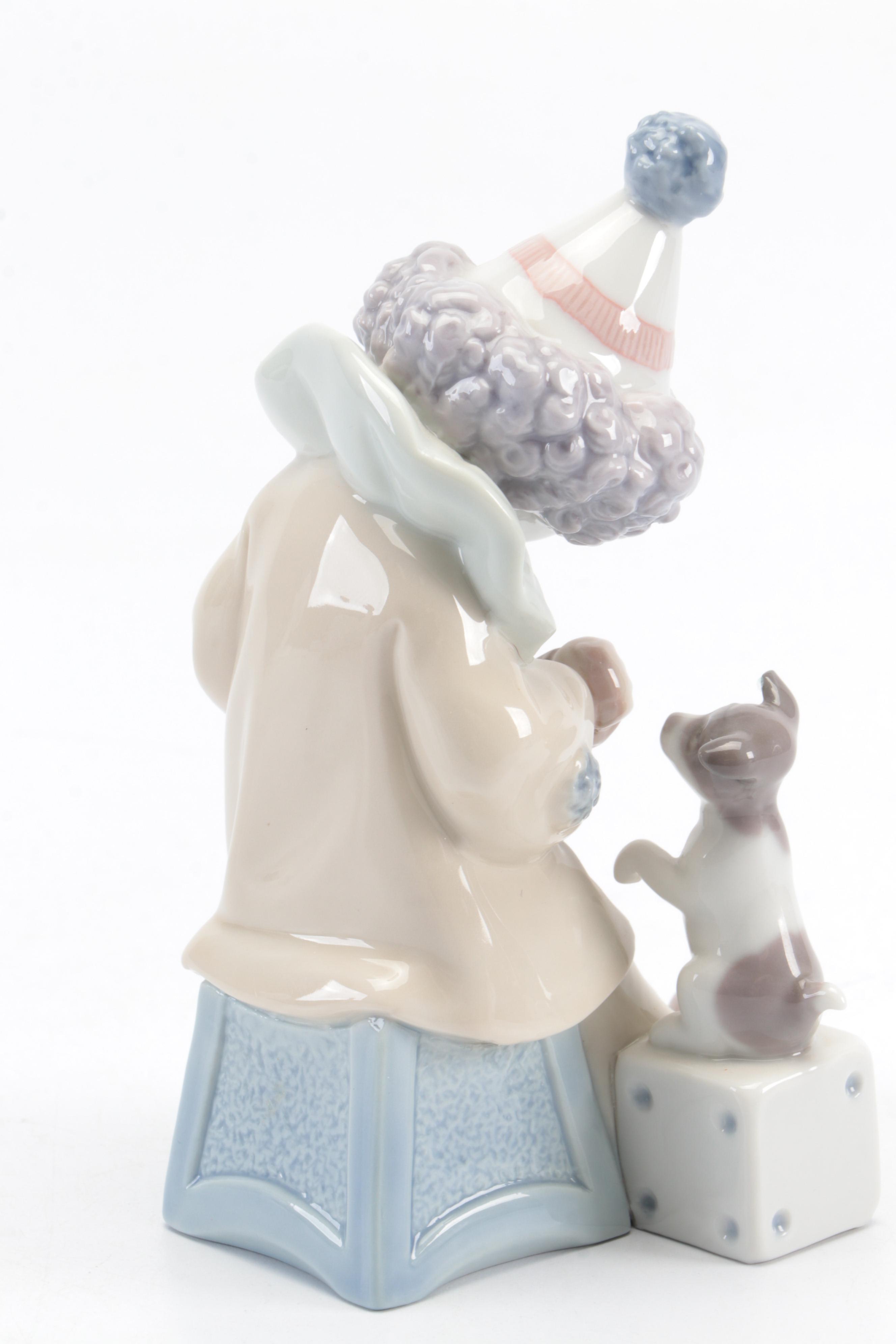 Lladró "Pierrot with Concertina" and Nao by Lladró "Girl with Dove" Figurines