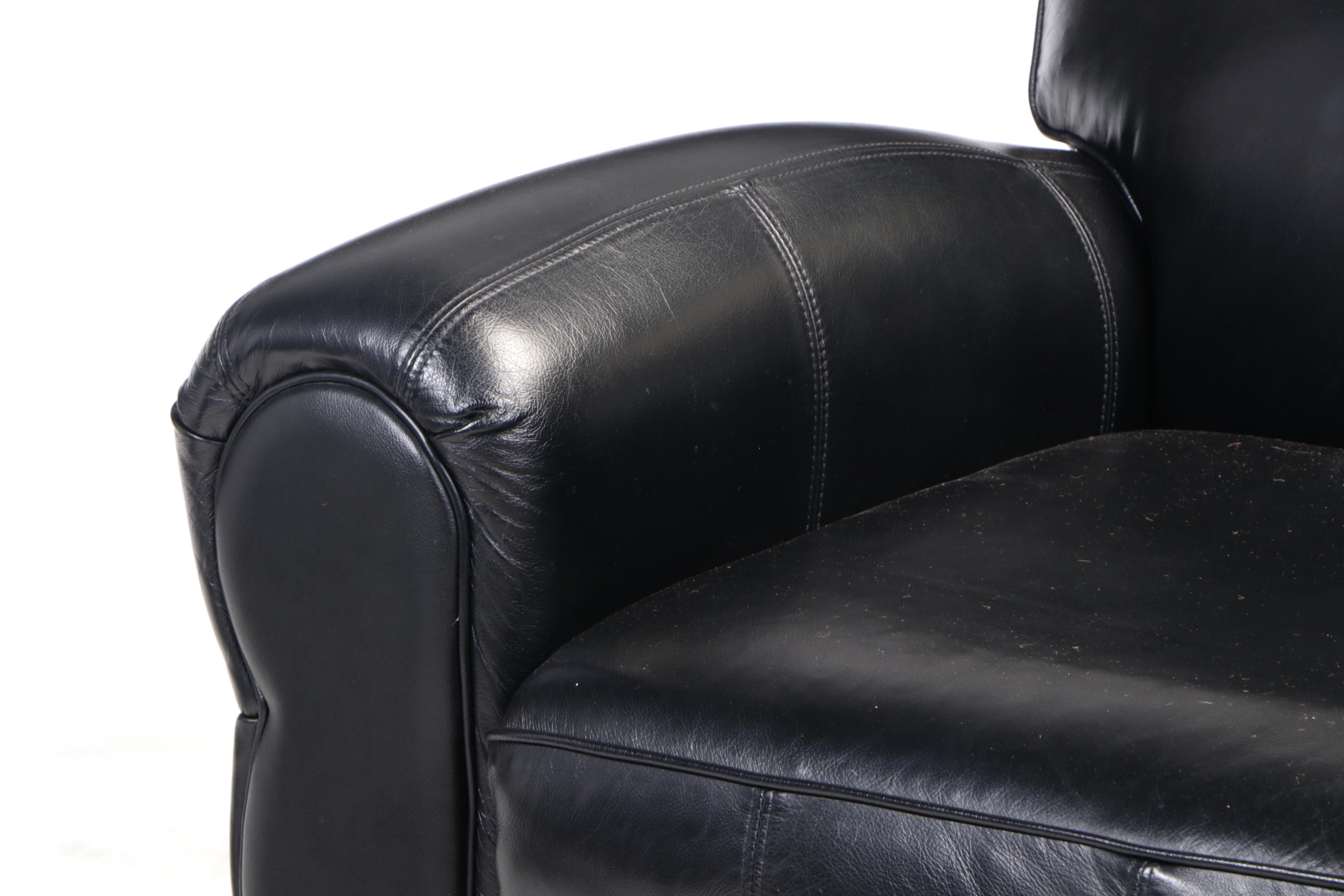 Contemporary Leather Upholstered Armchair and Ottoman