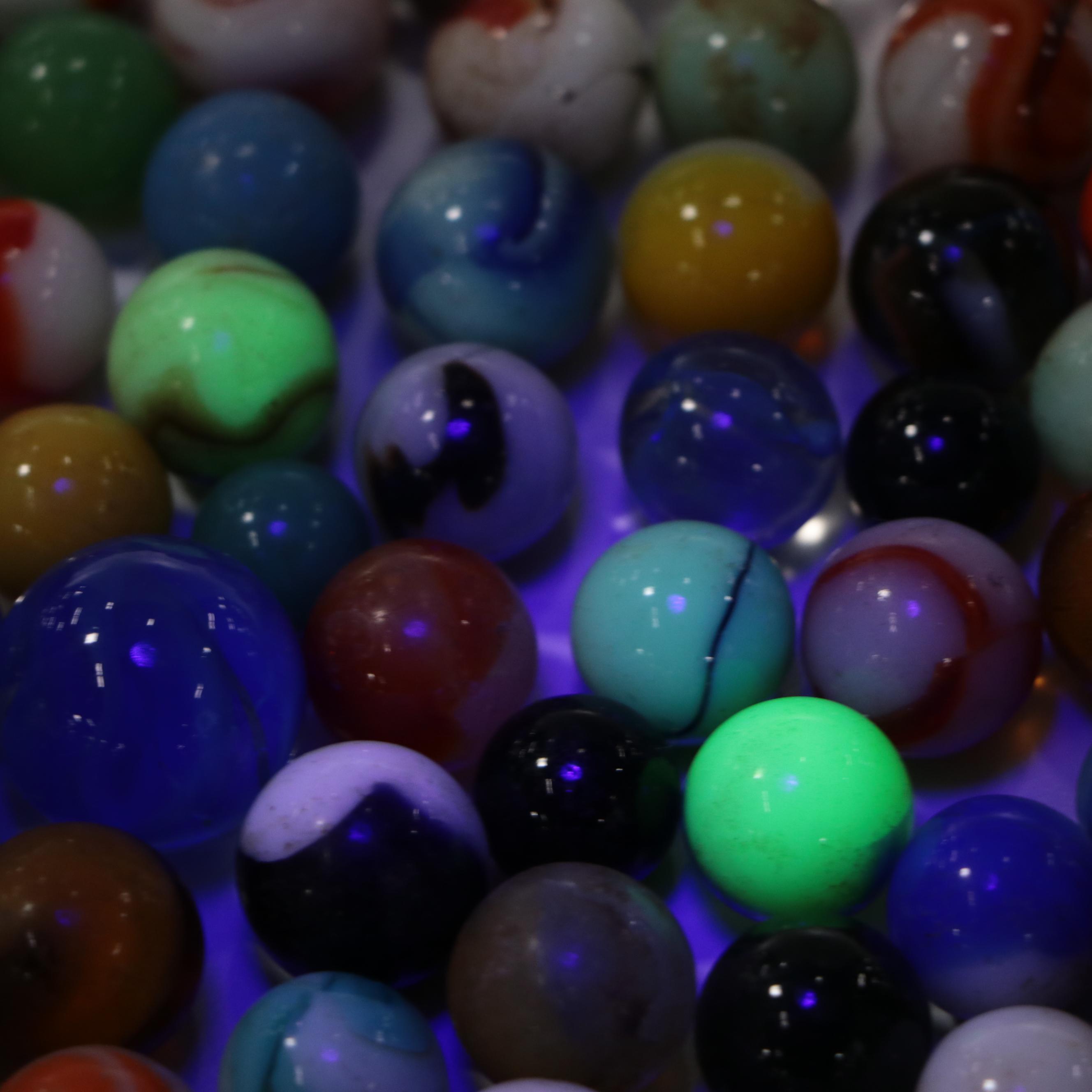 Uranium Glass with Other Marbles and Shooters