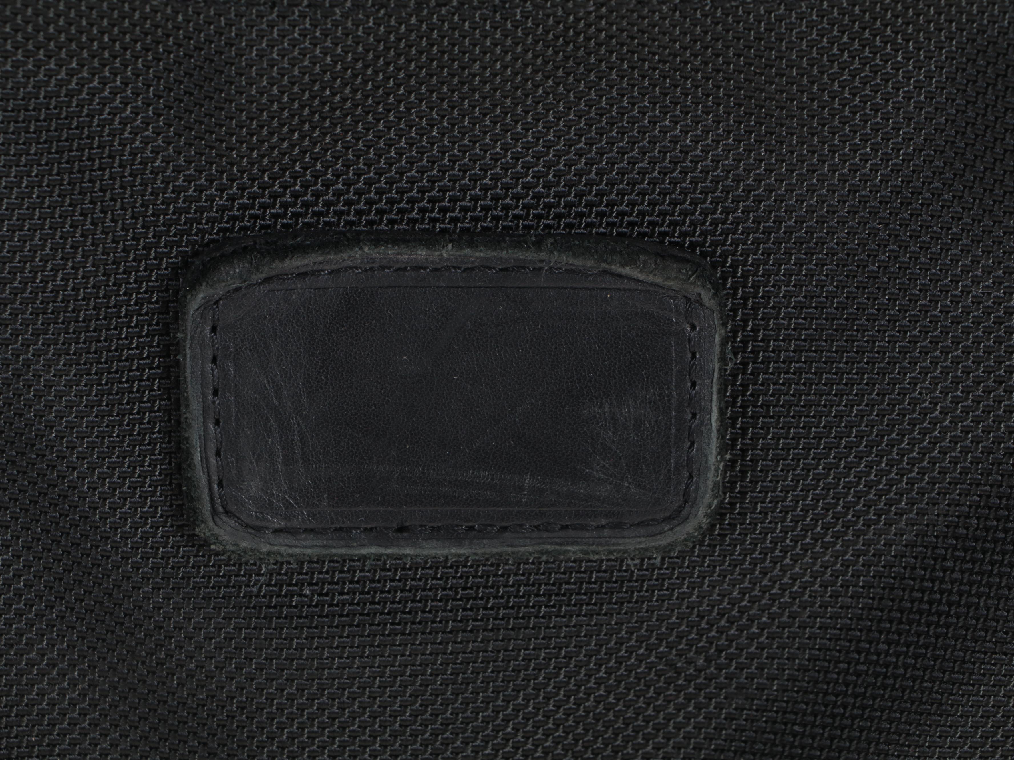 Three Tumi Soft-Sided Rolling Suitcases