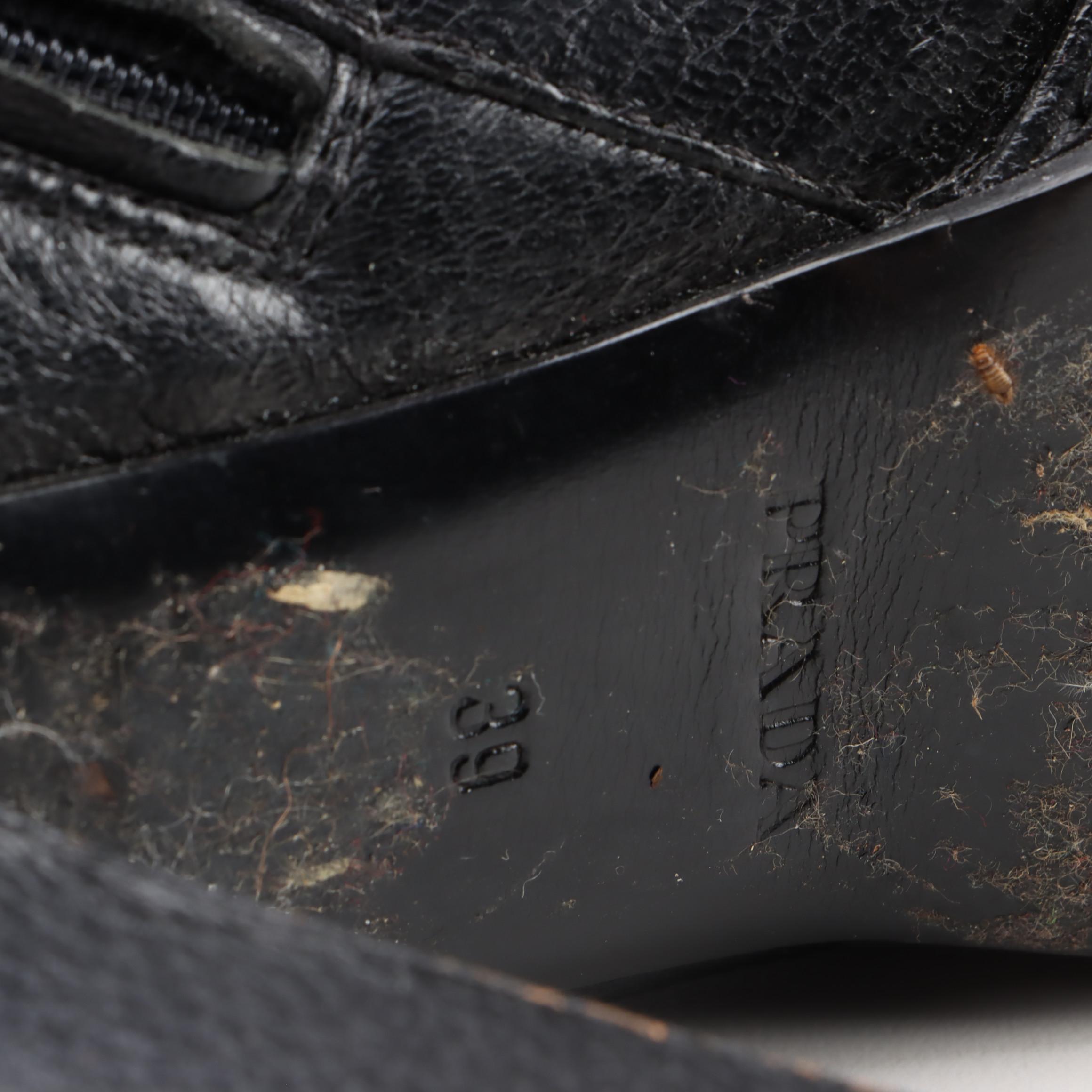 Prada Knee-High Heeled Boots in Black Grained Leather