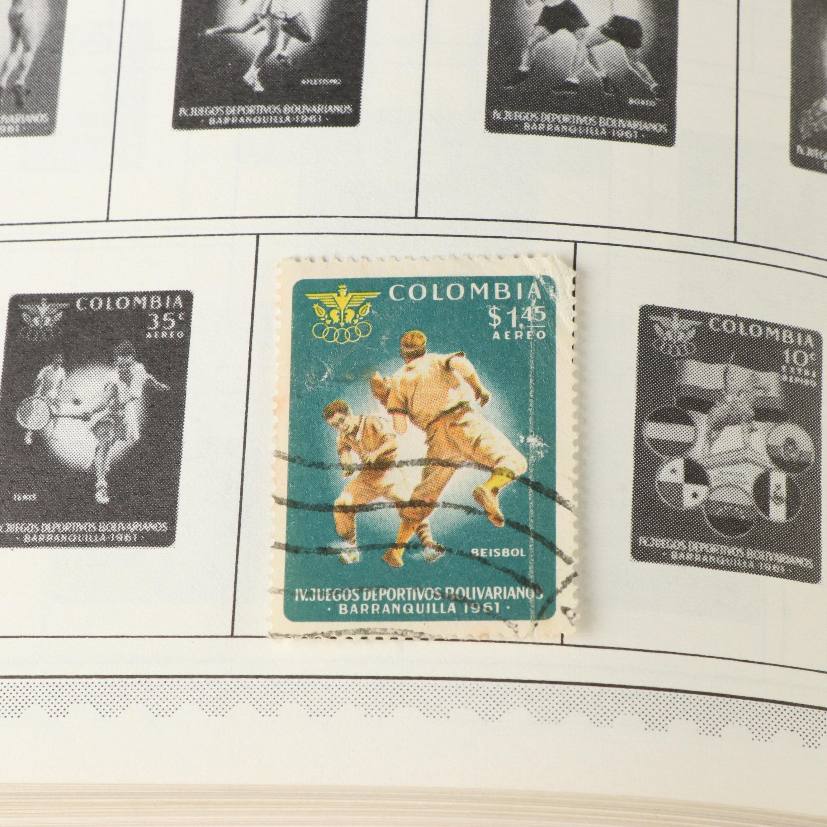 Three Postage Stamp Albums and a Stamp Guide