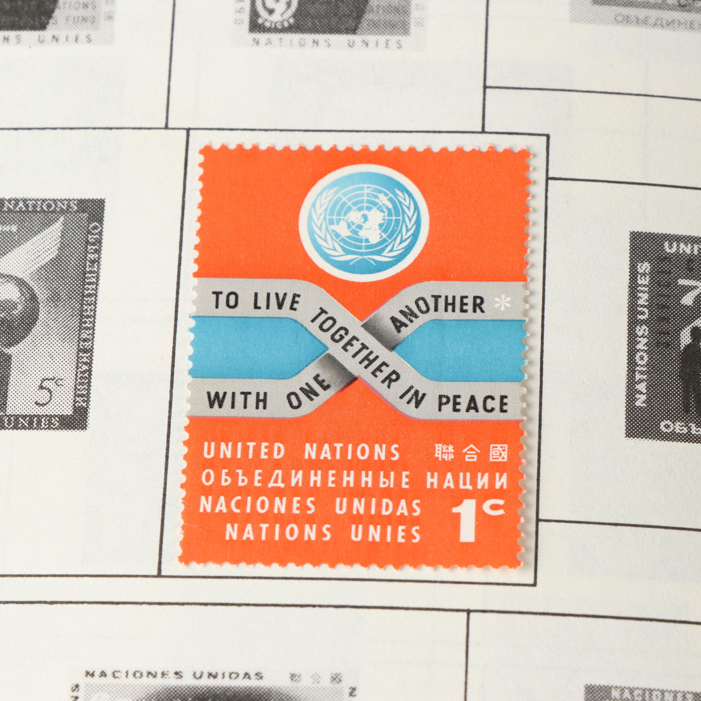 Three Postage Stamp Albums and a Stamp Guide