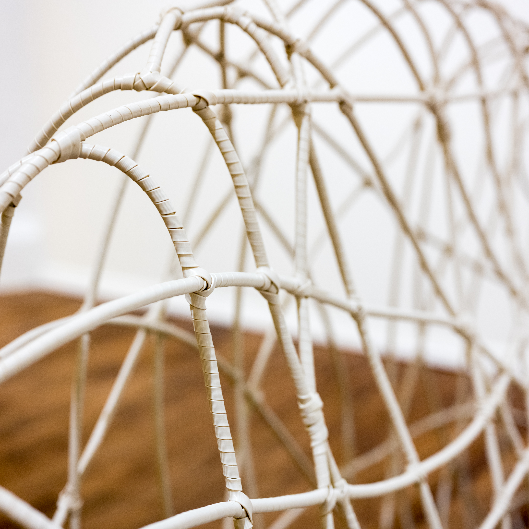 Vinyl Spiral Wrapped Wire Sofa with Ikat Cushion and Accent Pillows