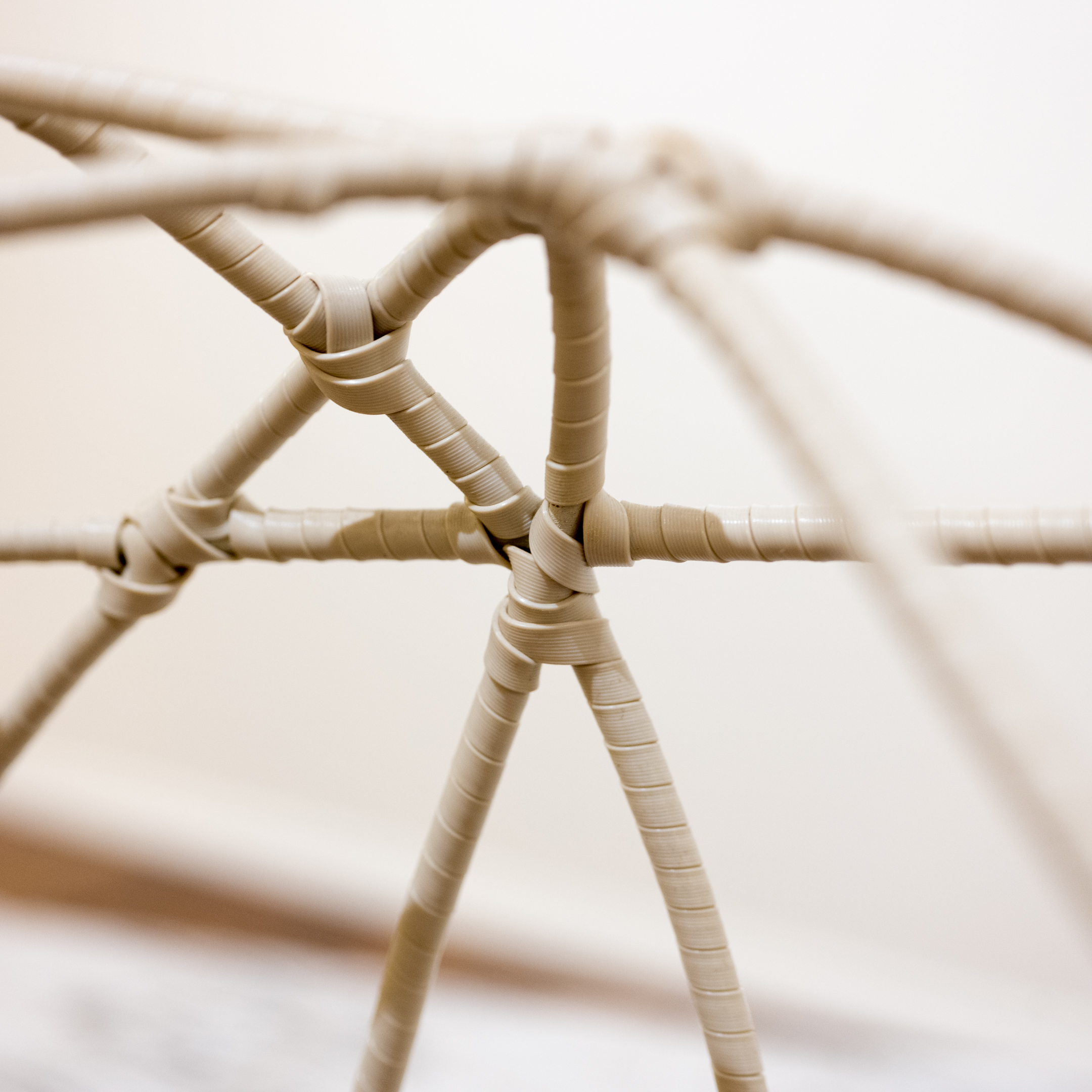 Vinyl Spiral Wrapped Wire Sofa with Ikat Cushion and Accent Pillows