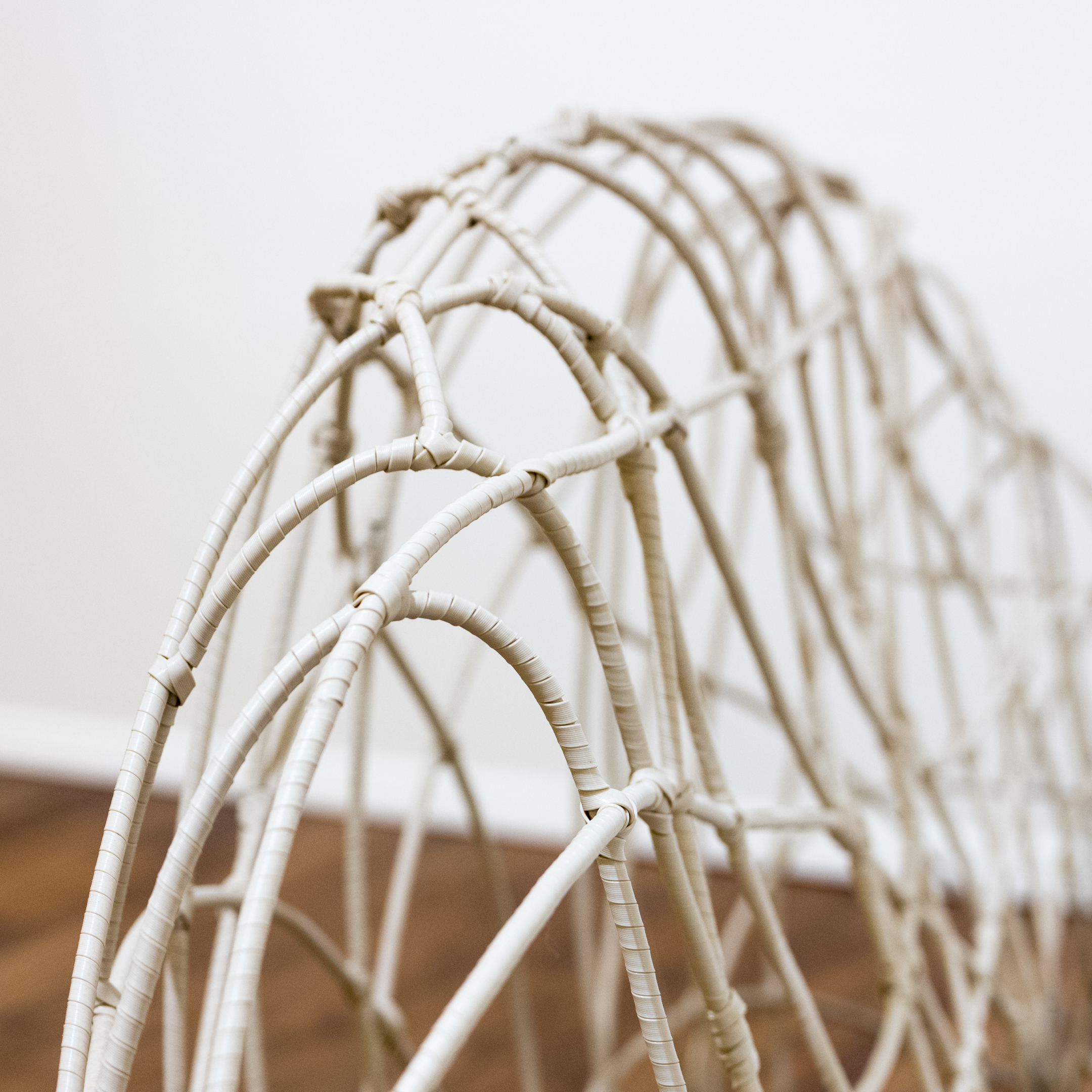 Vinyl Spiral Wrapped Wire Sofa with Ikat Cushion and Accent Pillows