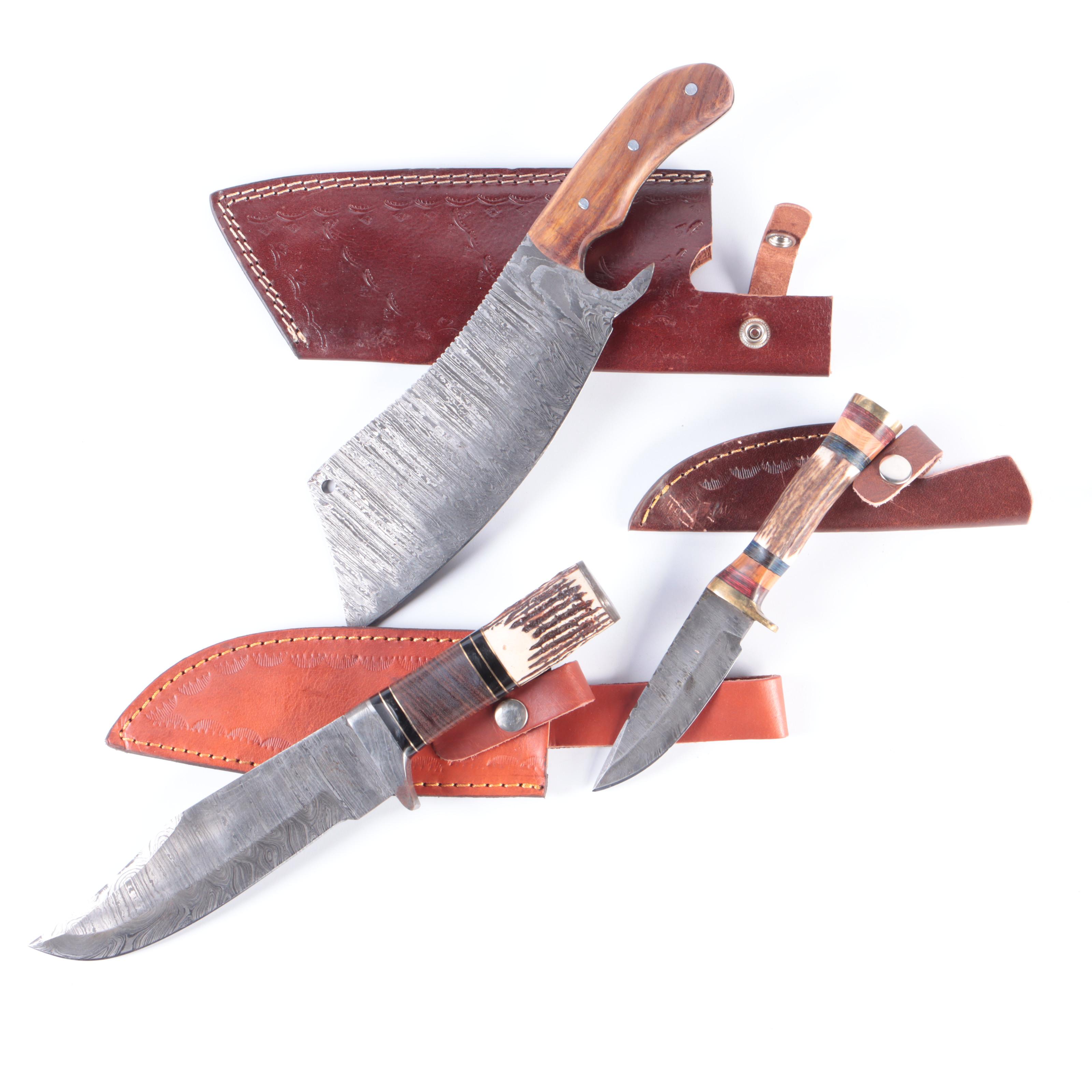 Damascus Steel Cleaver and Fixed Blade Hunting Knives with Leather Scabbards