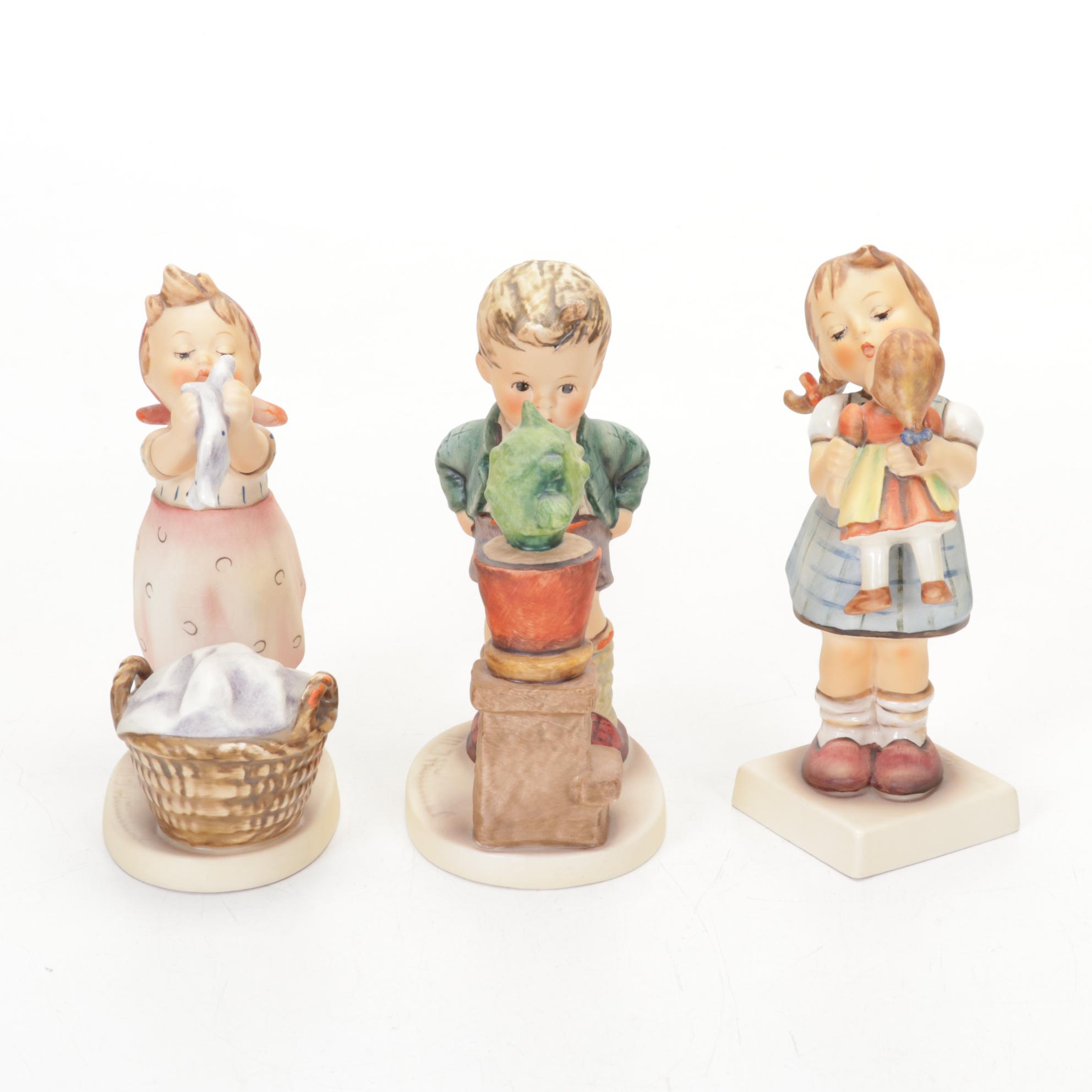 Goebel Hummel Porcelain Figurines Featuring Authorized Dealer Advertising Plaque