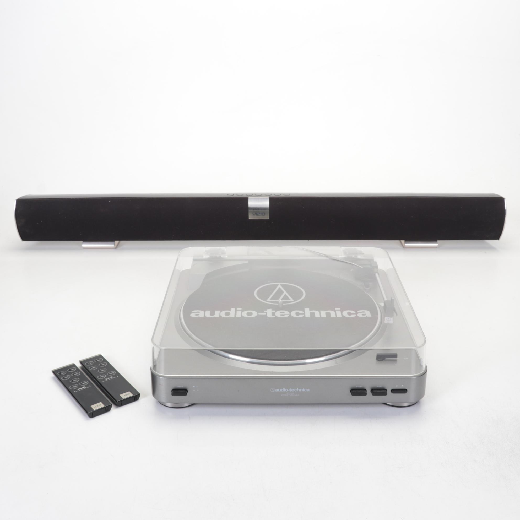 Audio-Technica Record Player With Vizio Soundbar and Two Remotes