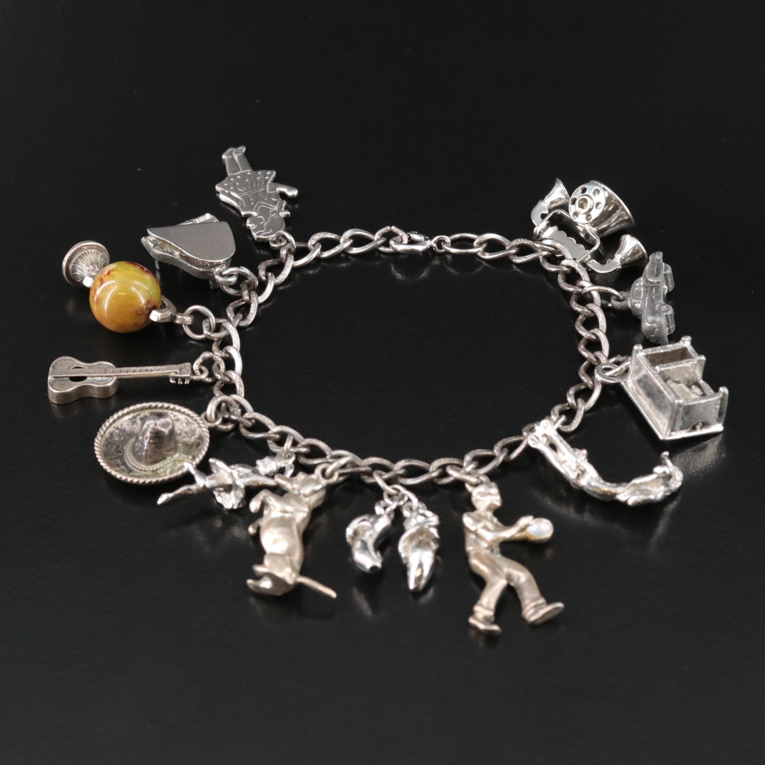 Vintage Sterling Charm Bracelet featuring Bakelite Globe EBTH