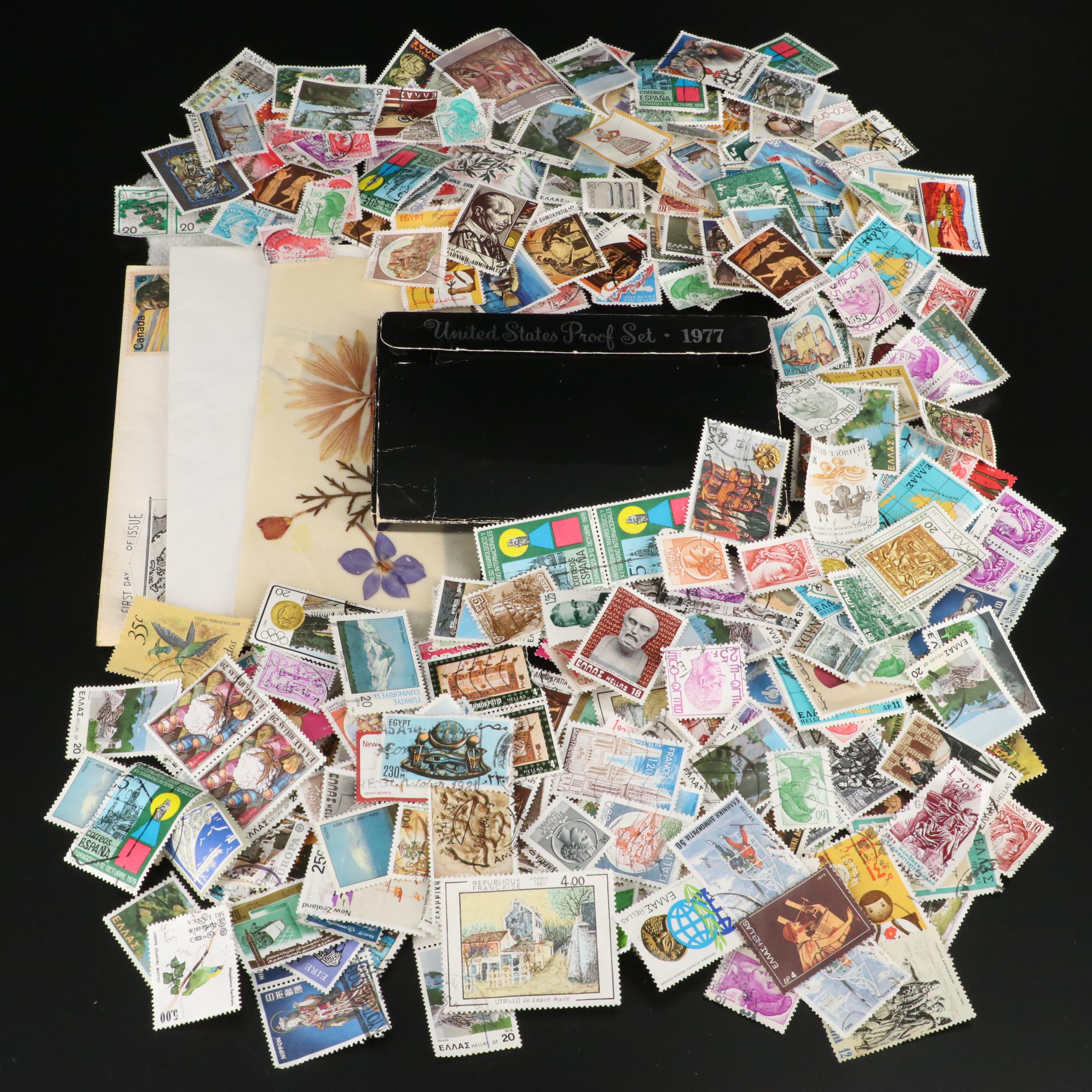 Large Assortment of Foreign Postage Stamps and a U.S. Mint Coin Proof Set