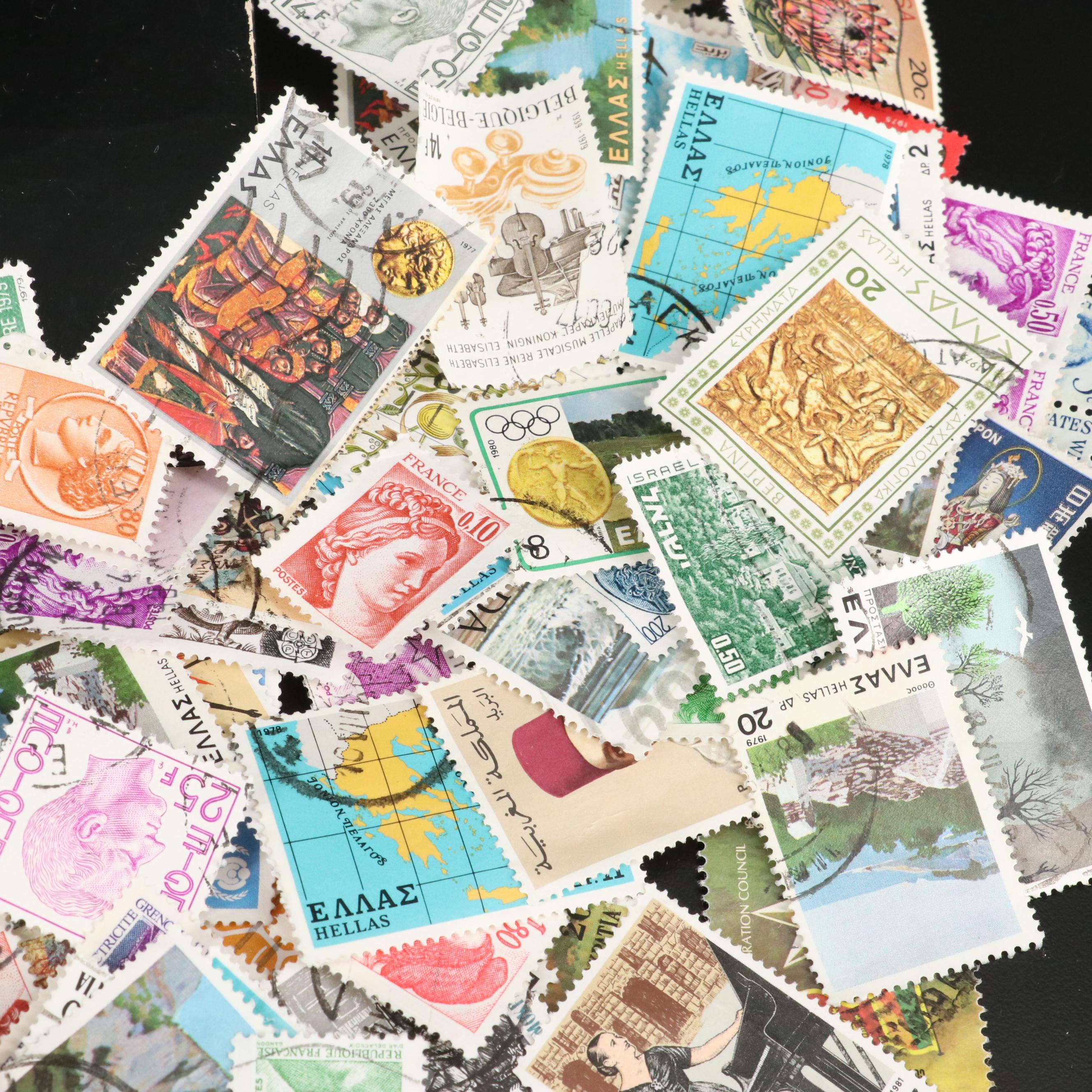 Large Assortment of Foreign Postage Stamps and a U.S. Mint Coin Proof Set