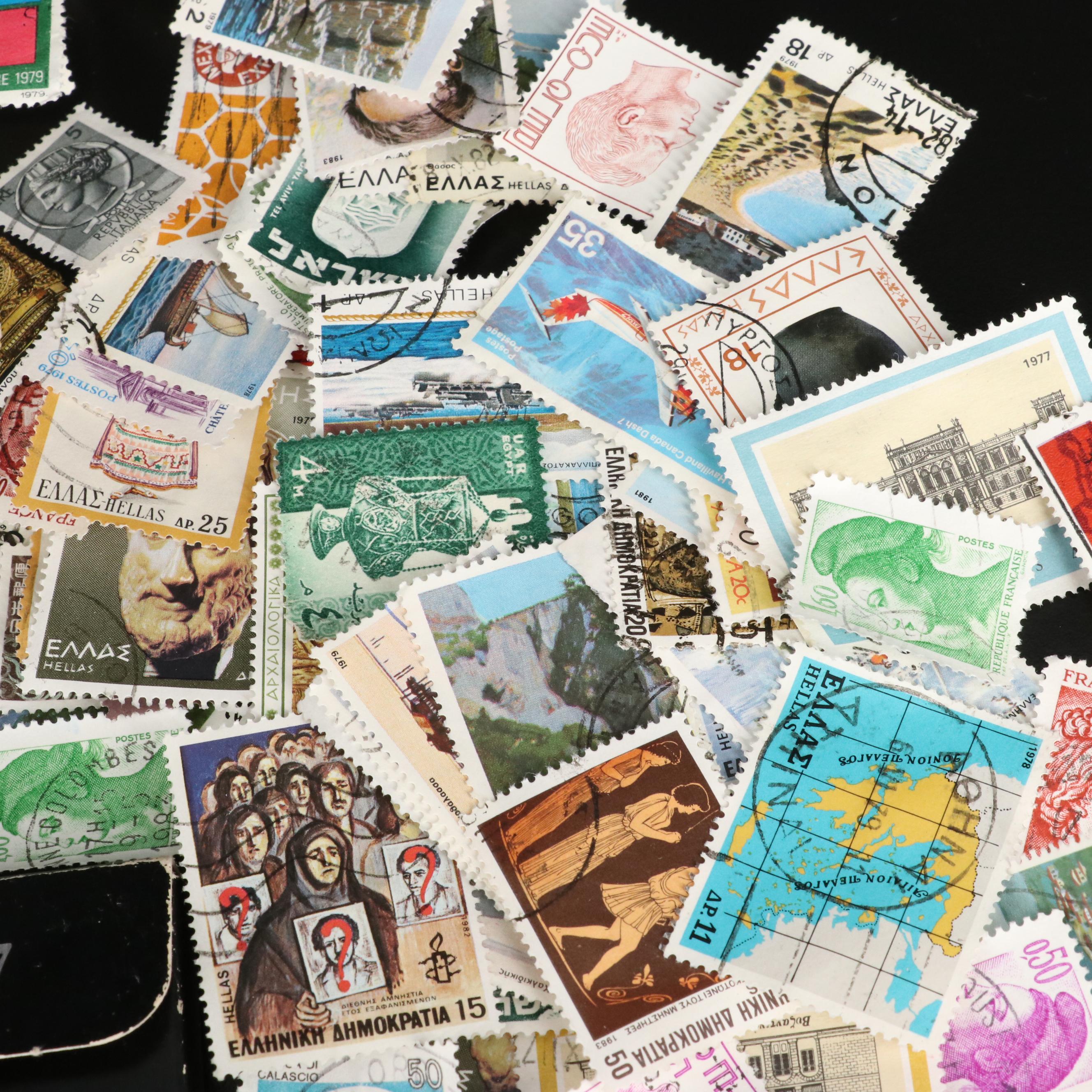 Large Assortment of Foreign Postage Stamps and a U.S. Mint Coin Proof Set