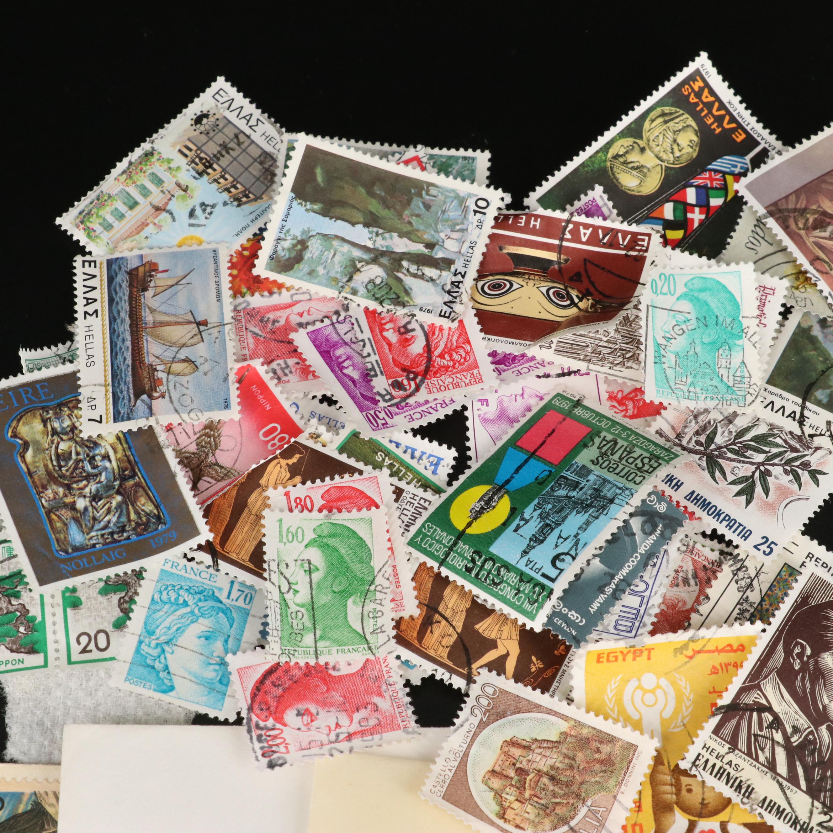 Large Assortment of Foreign Postage Stamps and a U.S. Mint Coin Proof Set