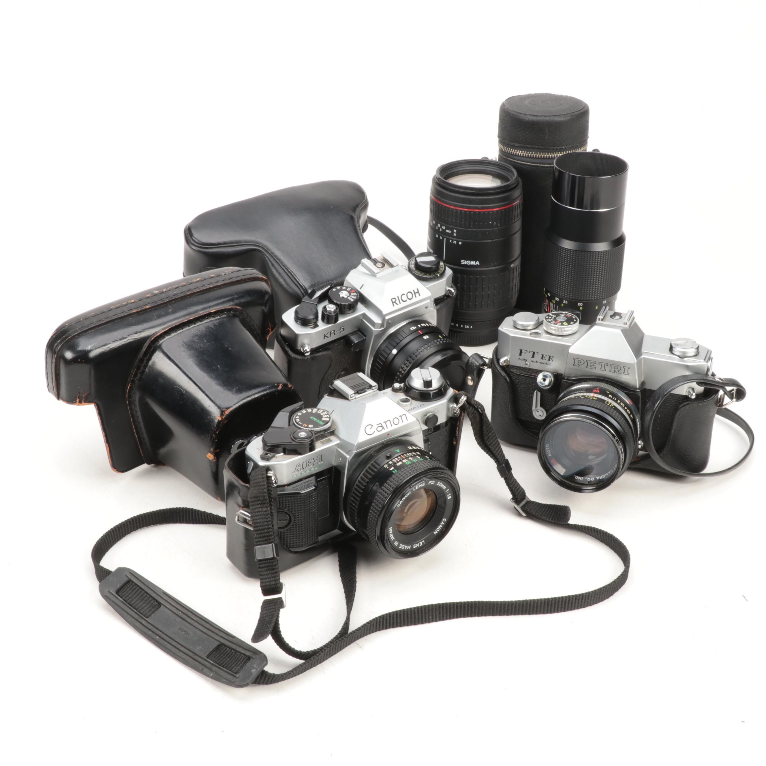 Canon AE-1, Ricoh KR-5 and Petri FTEE with Extra Telescoping Lenses