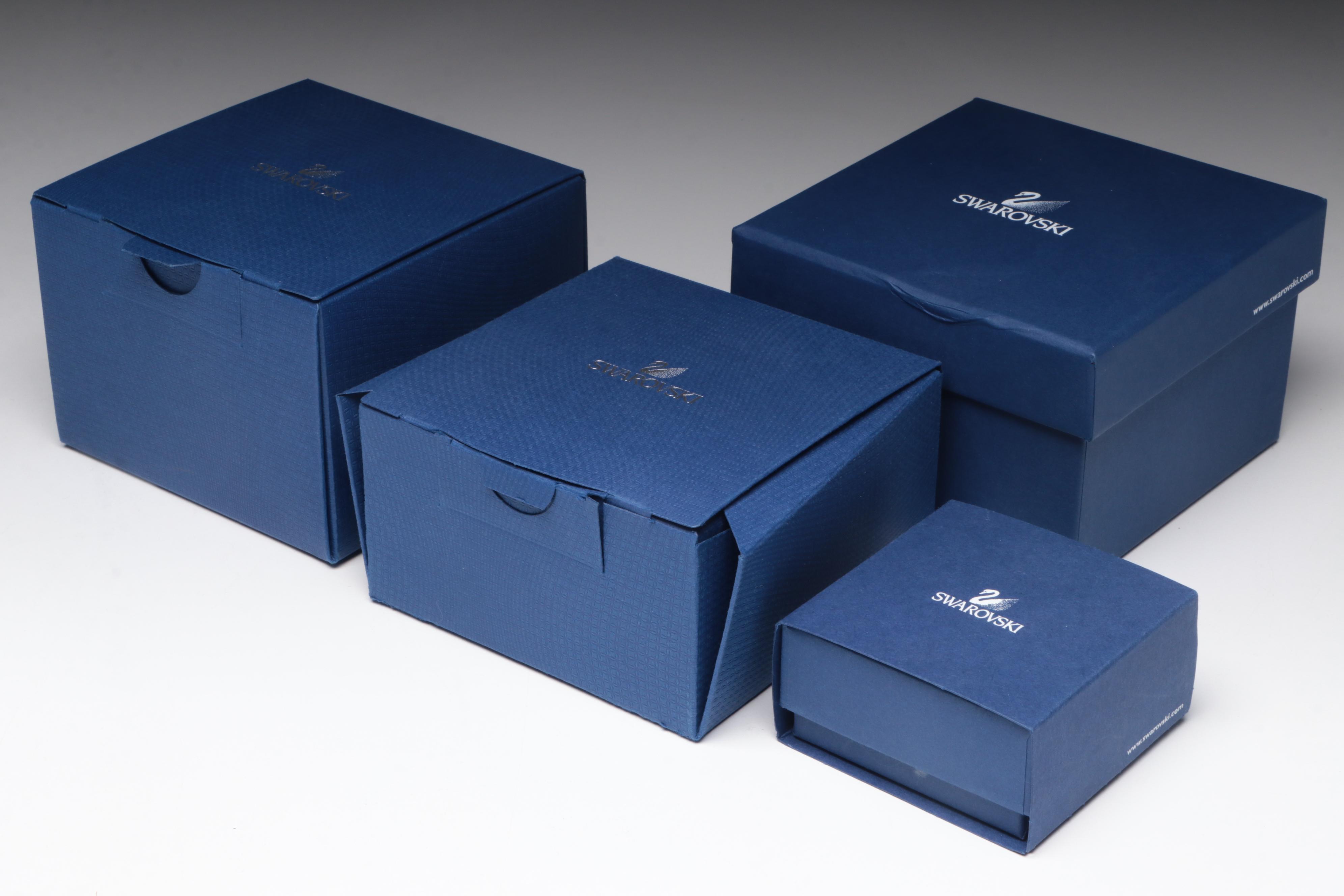 Swarovski Crystal Ornaments Featuring a Poinsettia and Christmas Tree