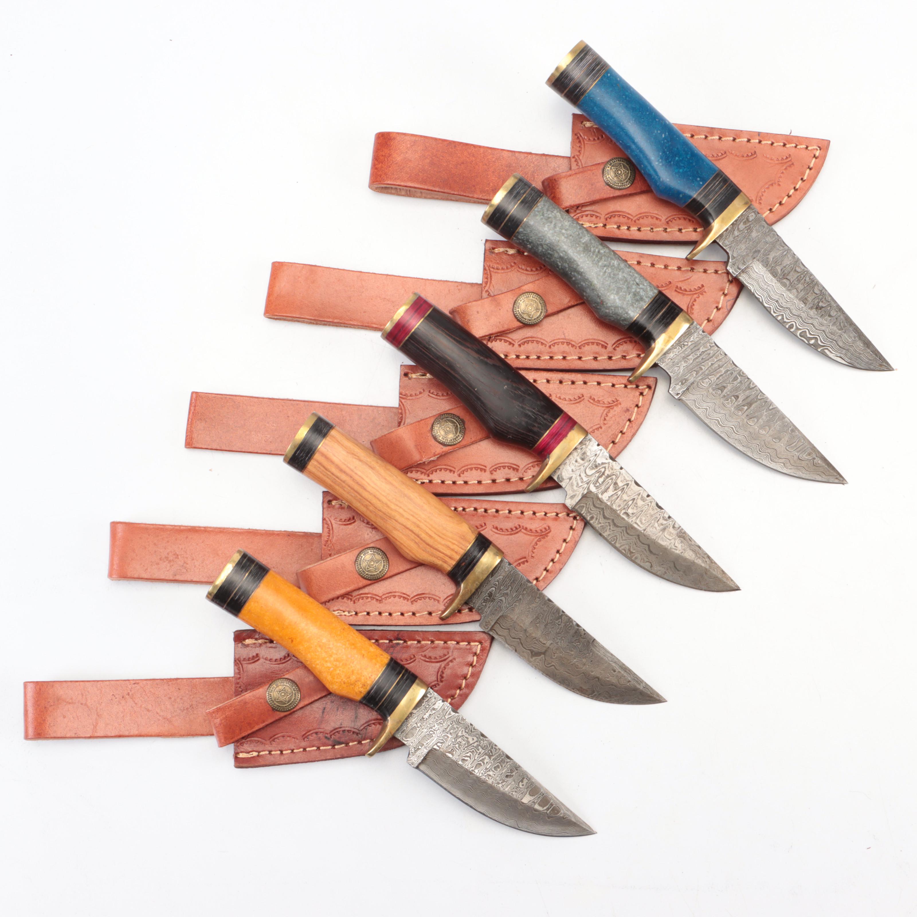 Five Damascus Steel Knives with Wood and Composite Handles and Leather Sheaths