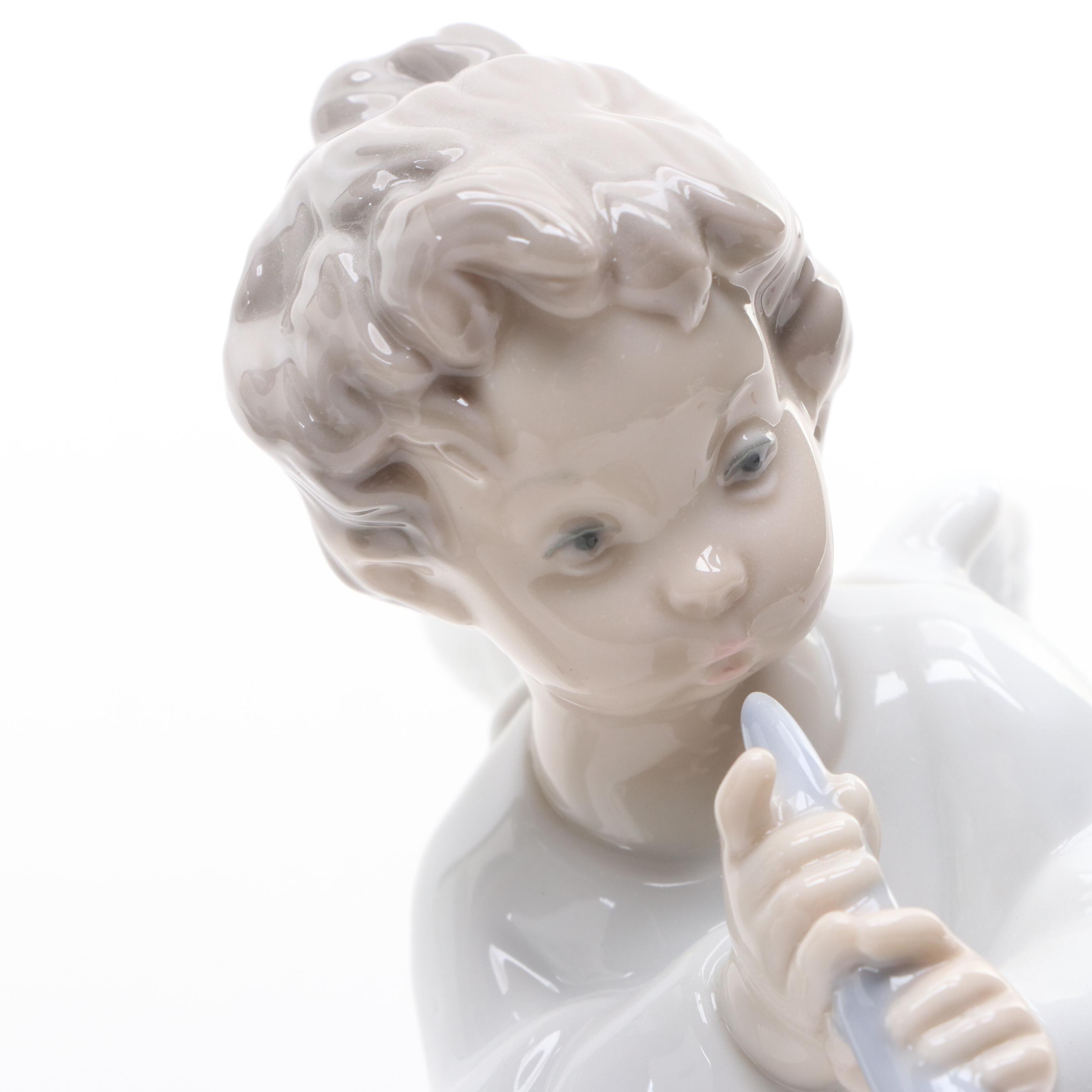 Lladró "Angels Group" and "Angel with Flute" Porcelain Figurines